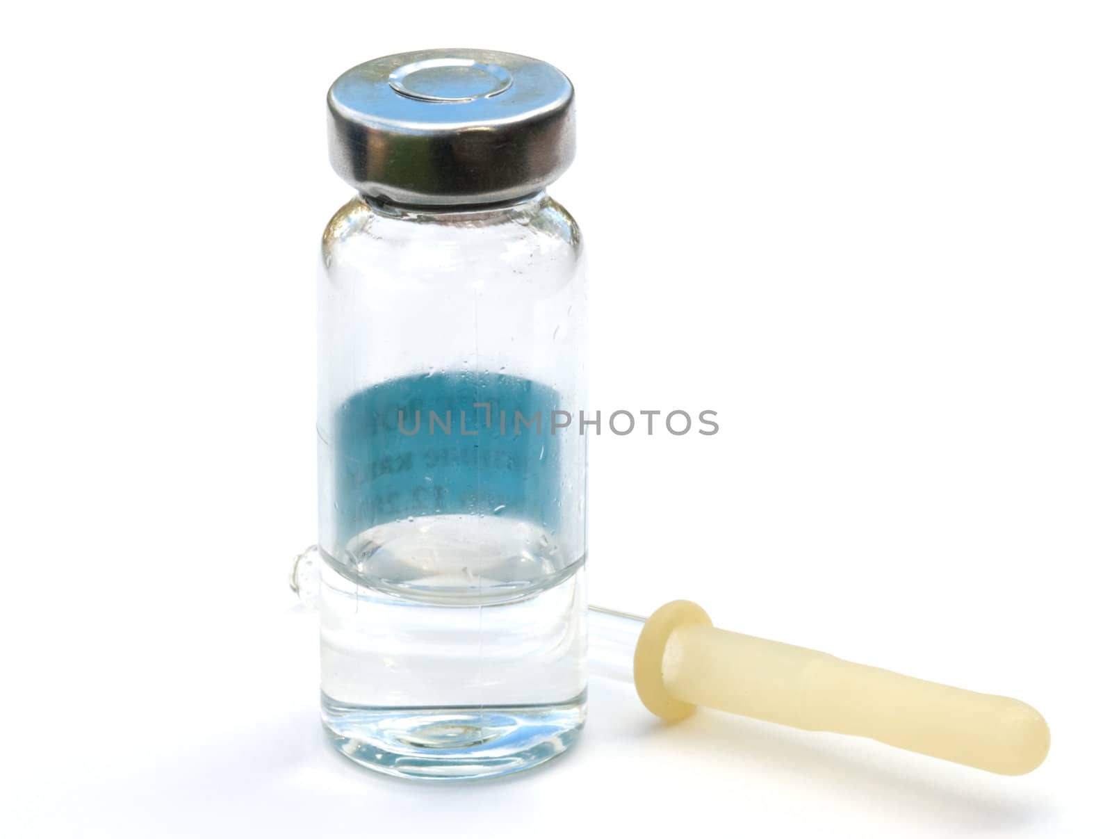 Vial with drops and a pipette on a white background a close up.