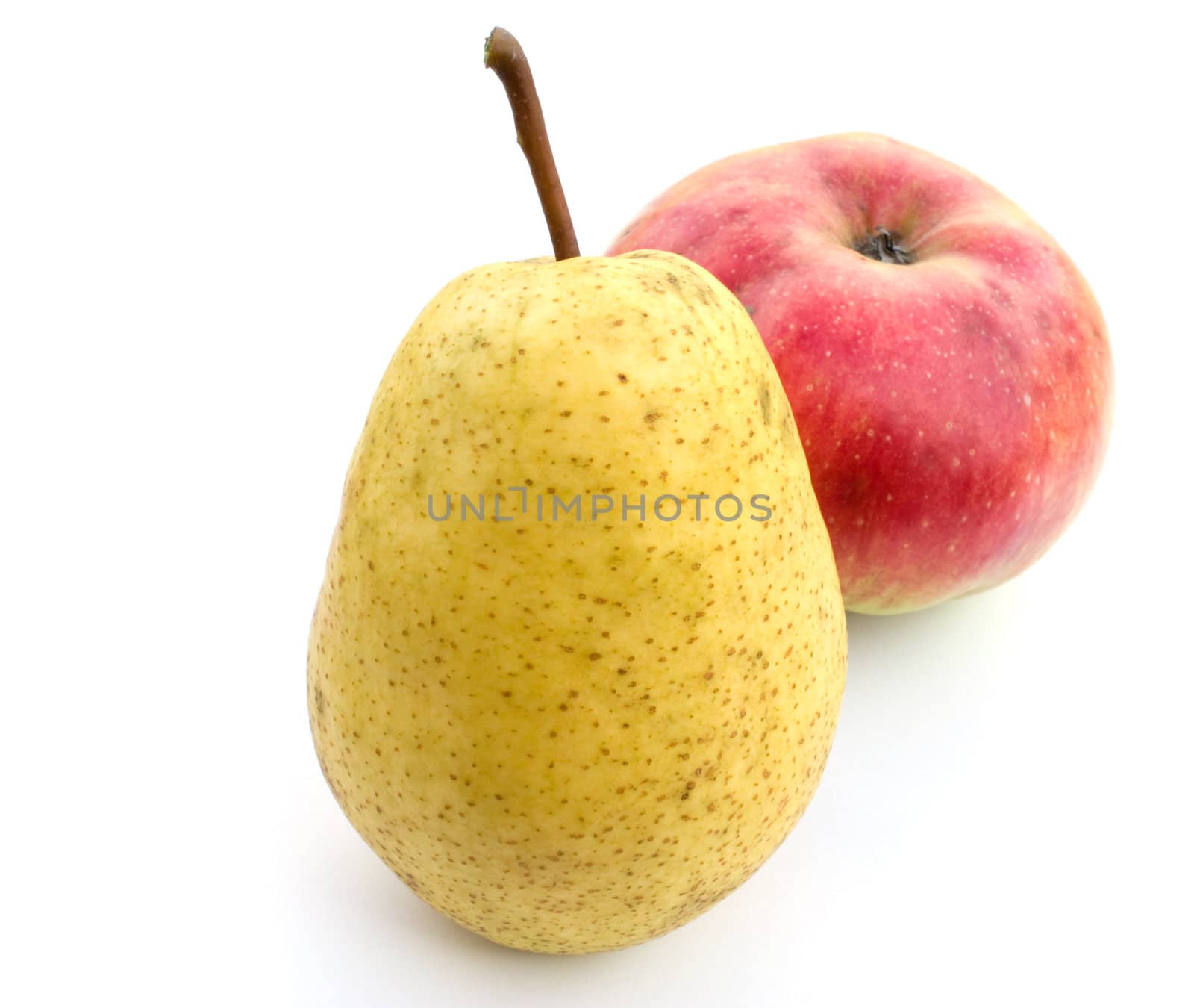 Yellow pear and red apple on a white background.