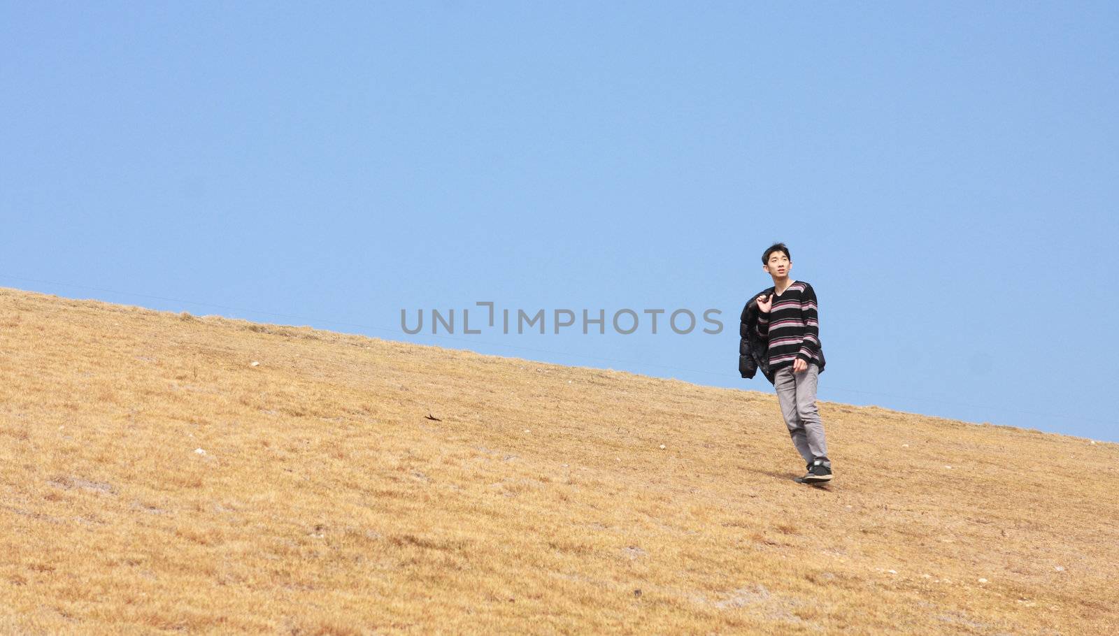 man walking on the mountain