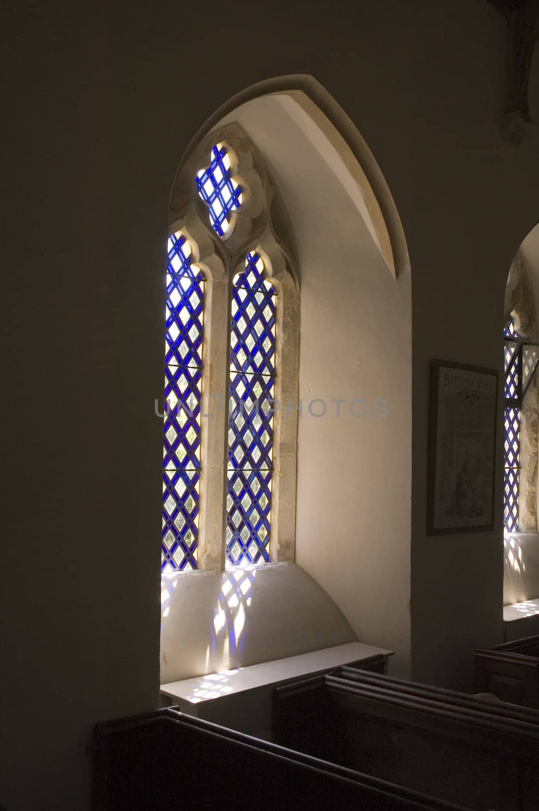 window in Norman style Church at Whitchurch in Dorset, England