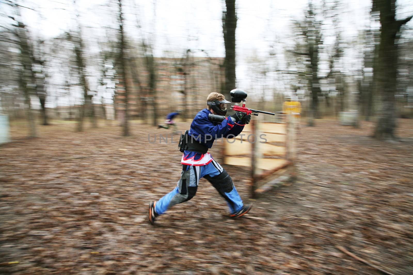 The running person with a gun for paintball