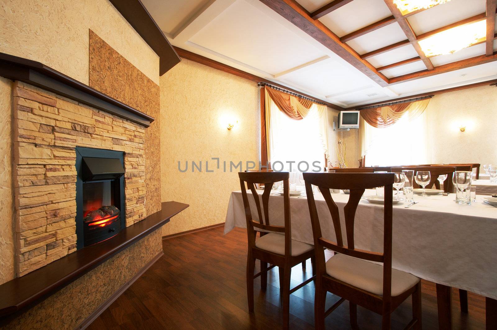 Fireplace in a lunch hall to modern hotel