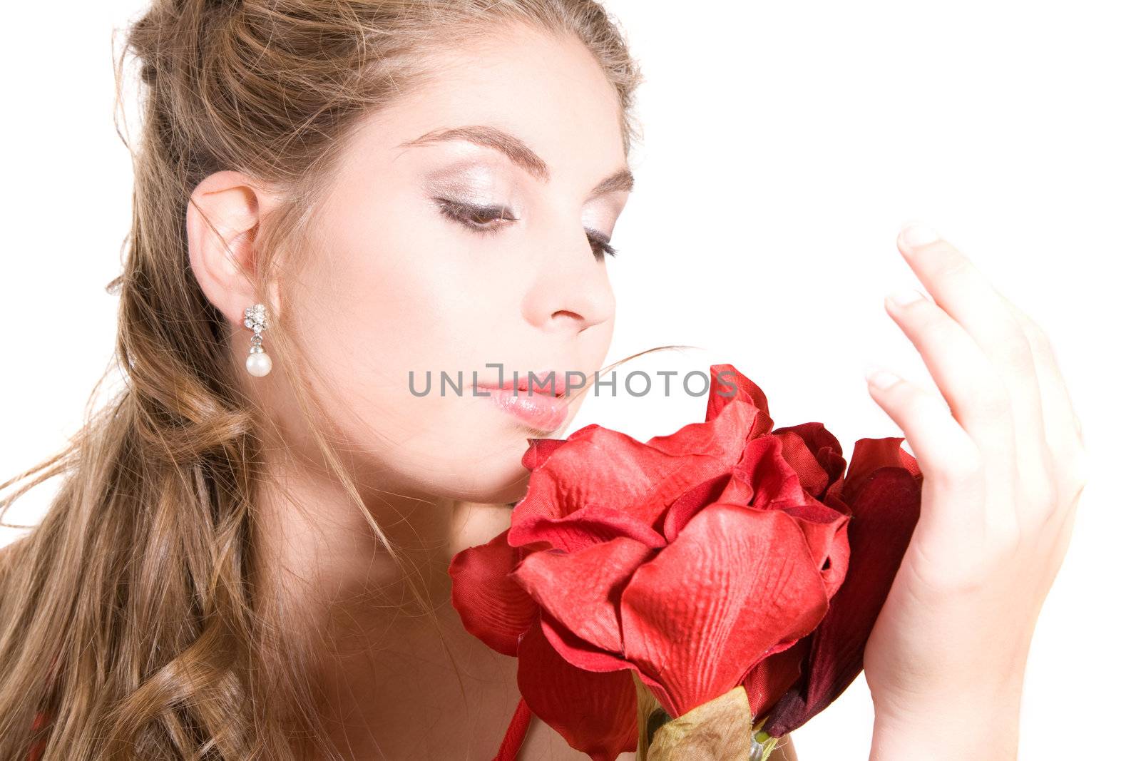 Pretty brunette holding an artificial flower in her hand