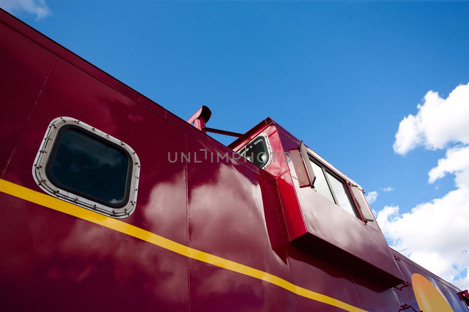 Detail of a shiny red train caboose