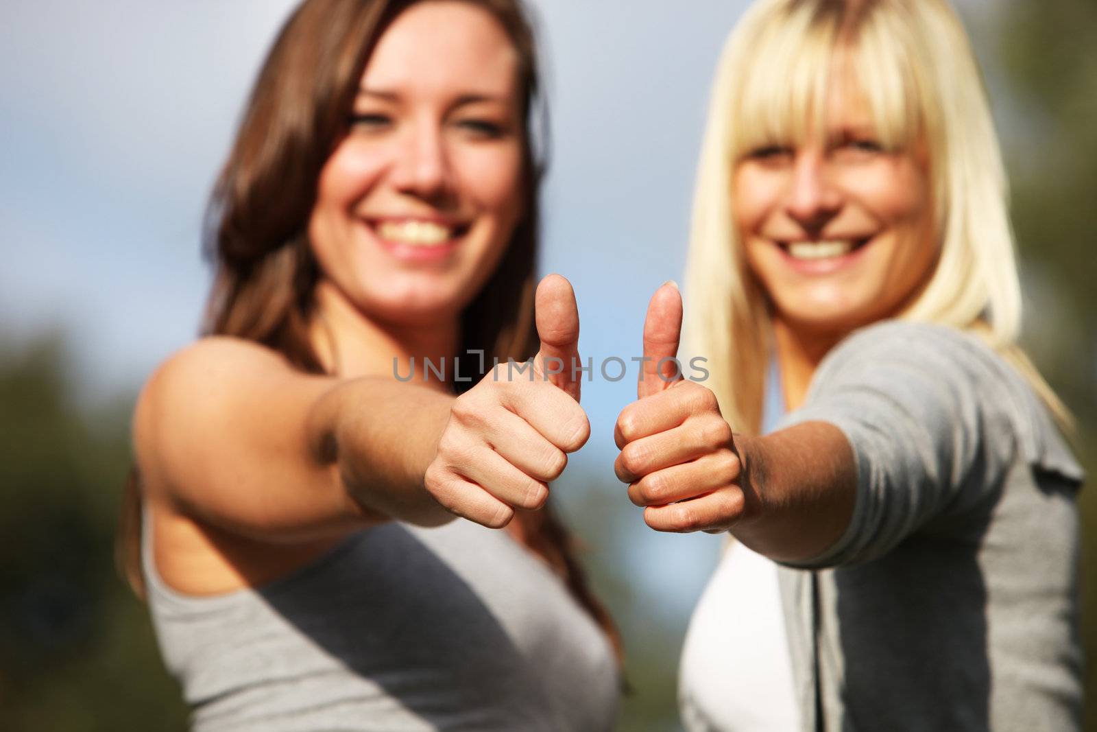 Two young women laughing positive by Farina6000