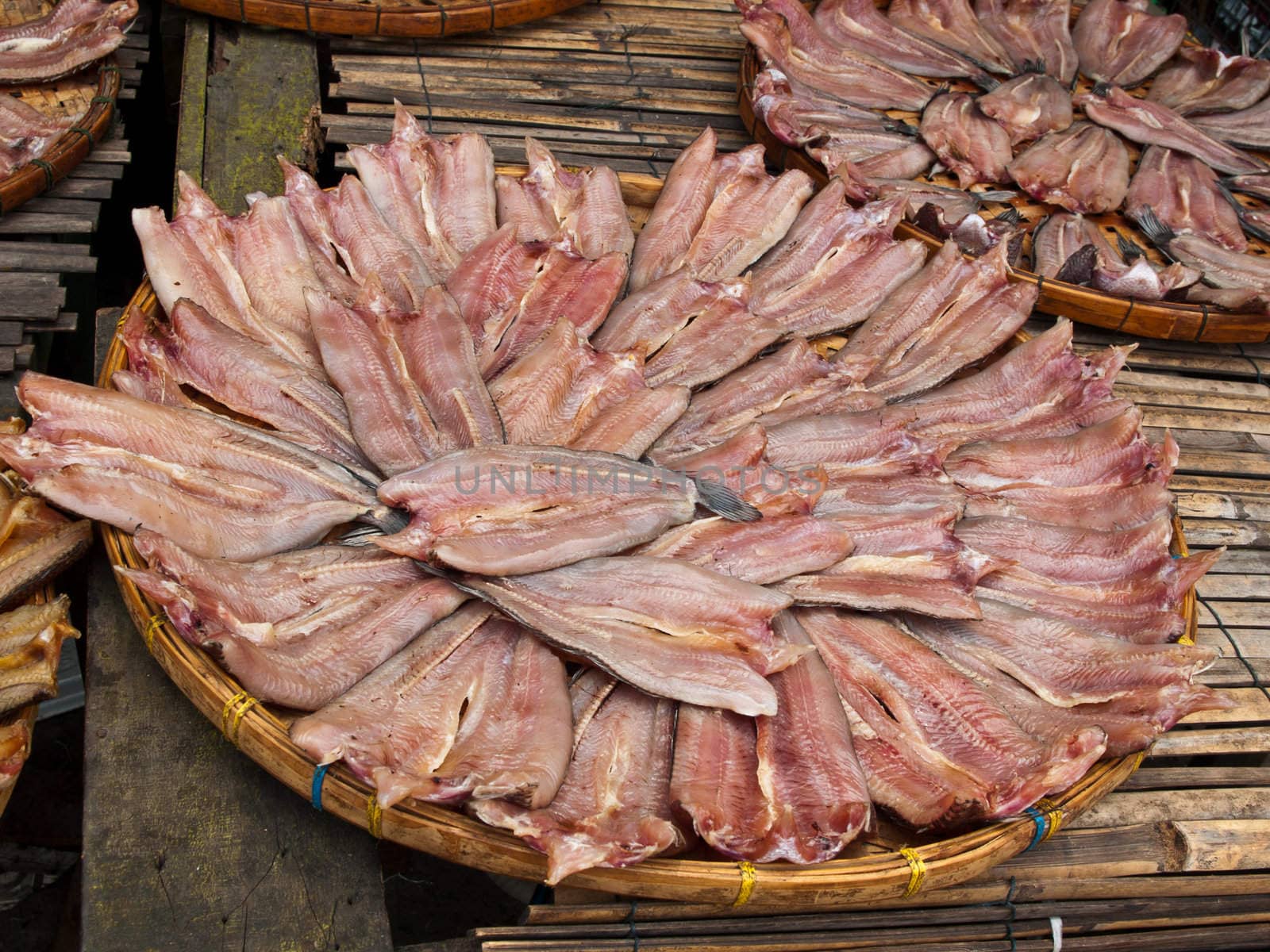 Striped snakehead fish, in a circle on plate