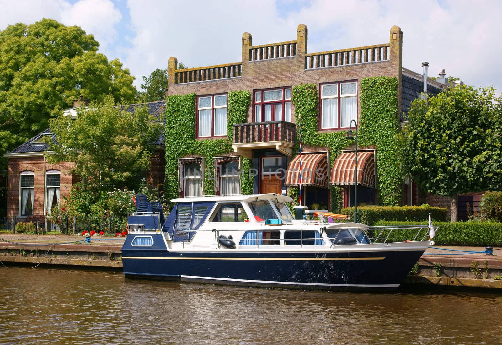 Yacht (boat) in scenic dutch town