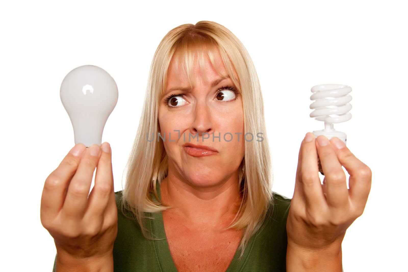 Funny Faced Woman Holds Energy Saving and Regular Light Bulbs Isolated on a White Background.