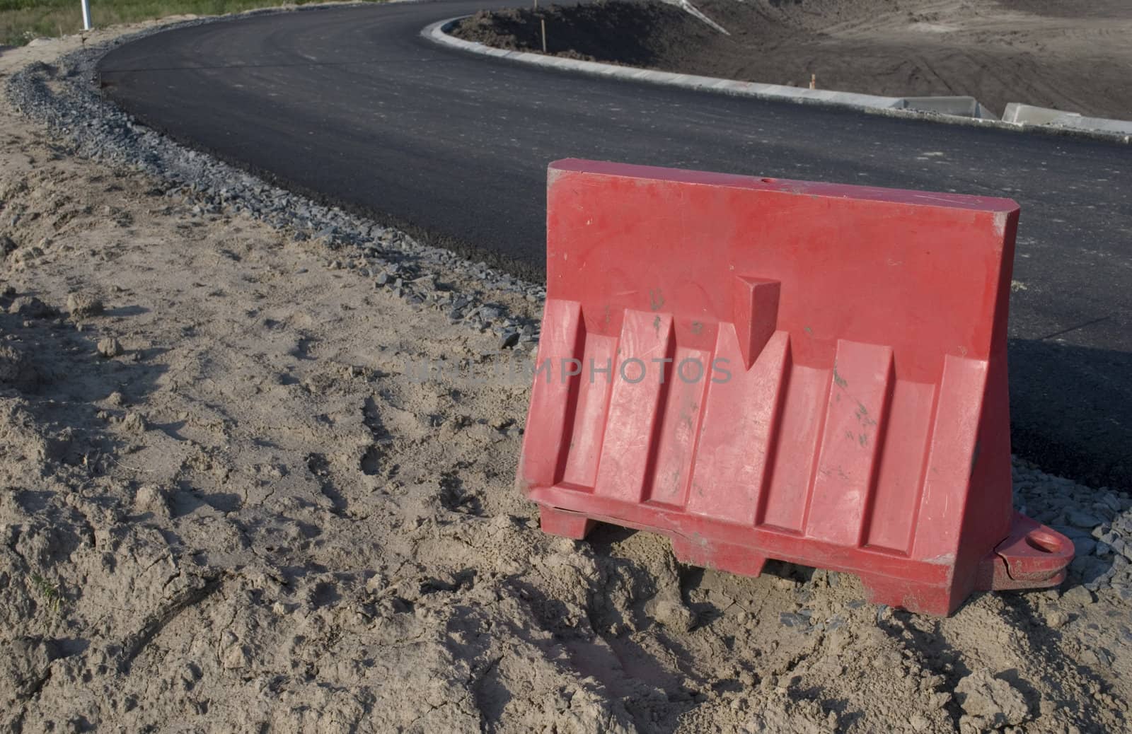 Road with freshly laid black tar asphalt pavement