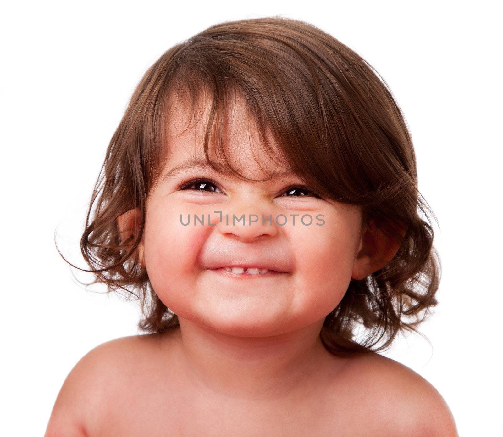 Cute happy funny baby toddler face smiling showing teeth, isolated.