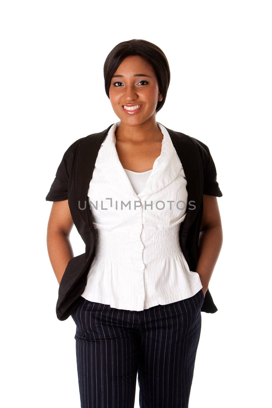 Beautiful attractive smiling corporate business woman standing with hands in pocket, isolated.