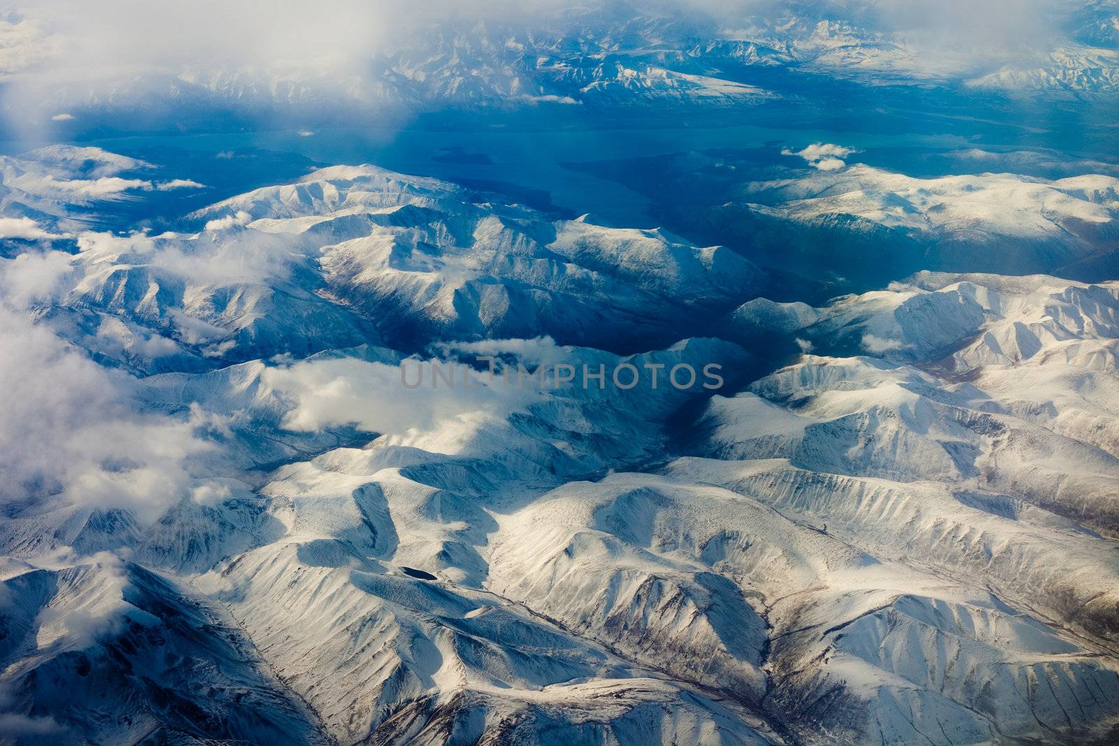 Aerial view of snowcapped mountains in Yukon Territory, Canada.