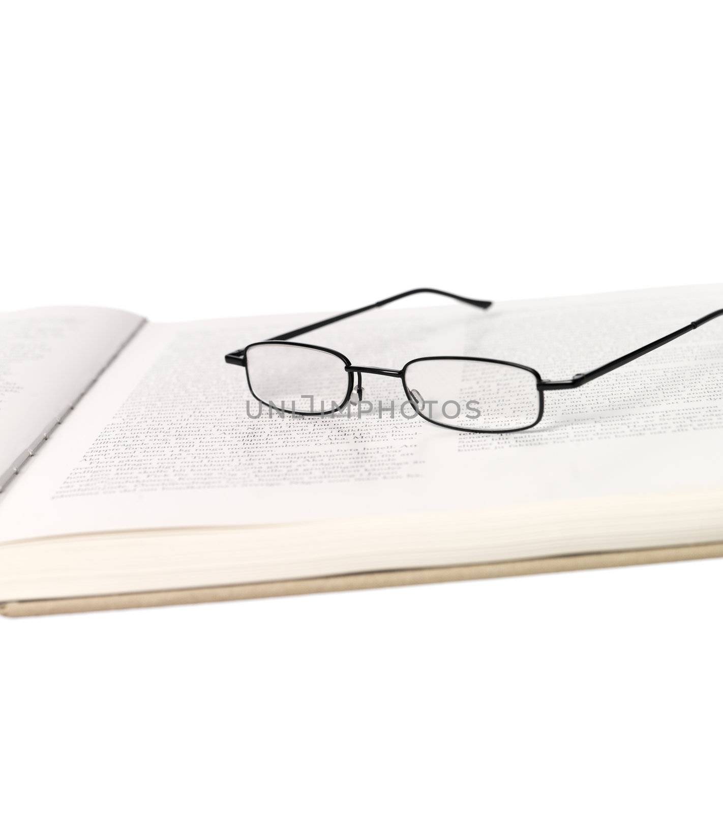 Reading-glasses in a spread book
