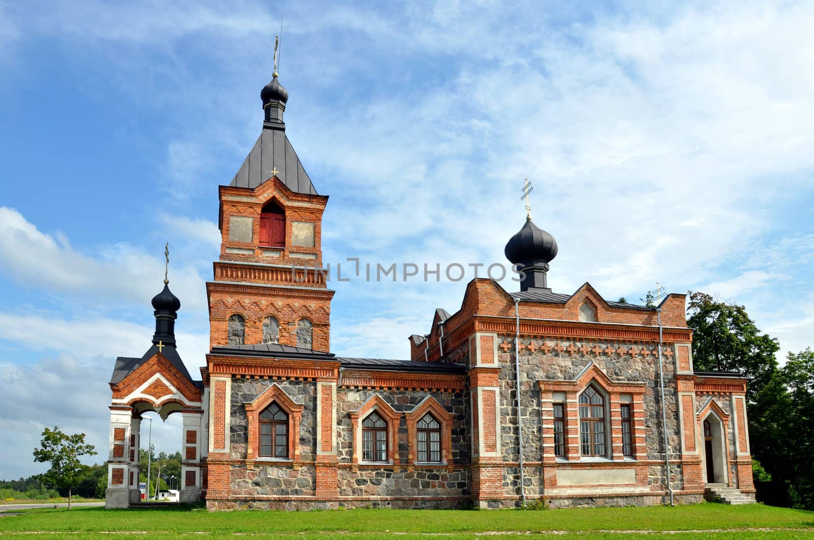 The church is constructed of a red brick and greater stones