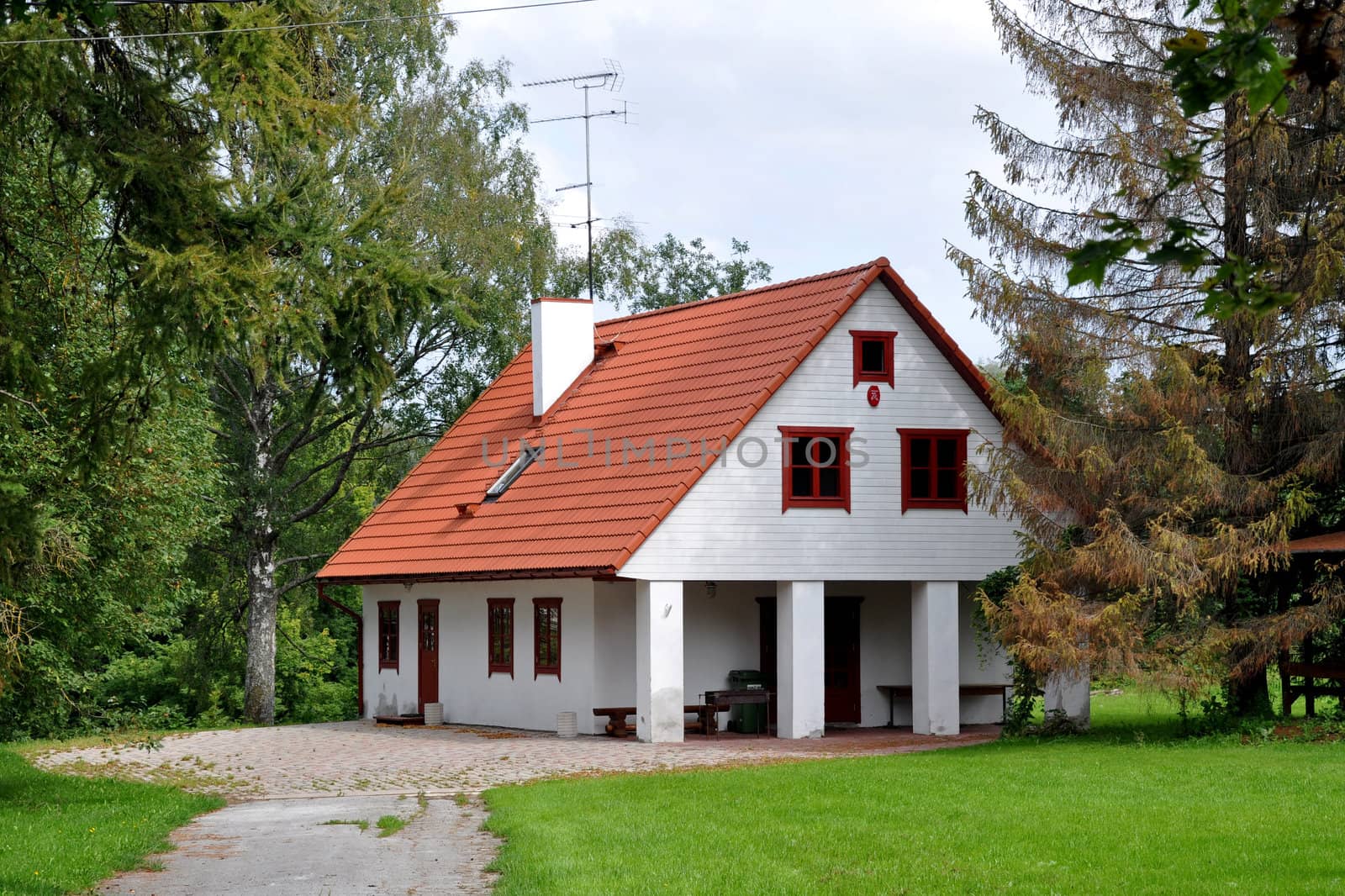 White apartment house with a red roof