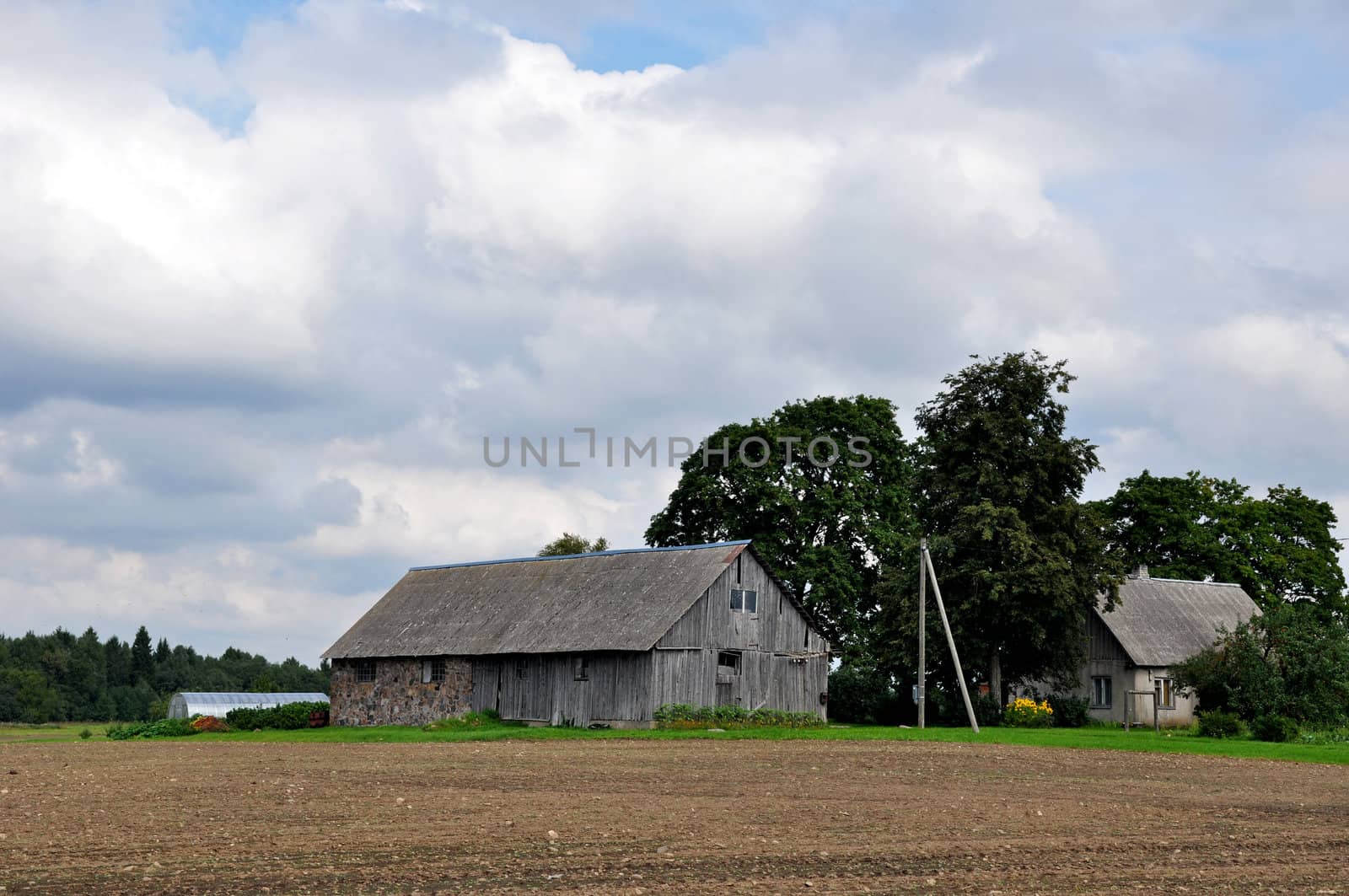 Old shed on a background of clouds