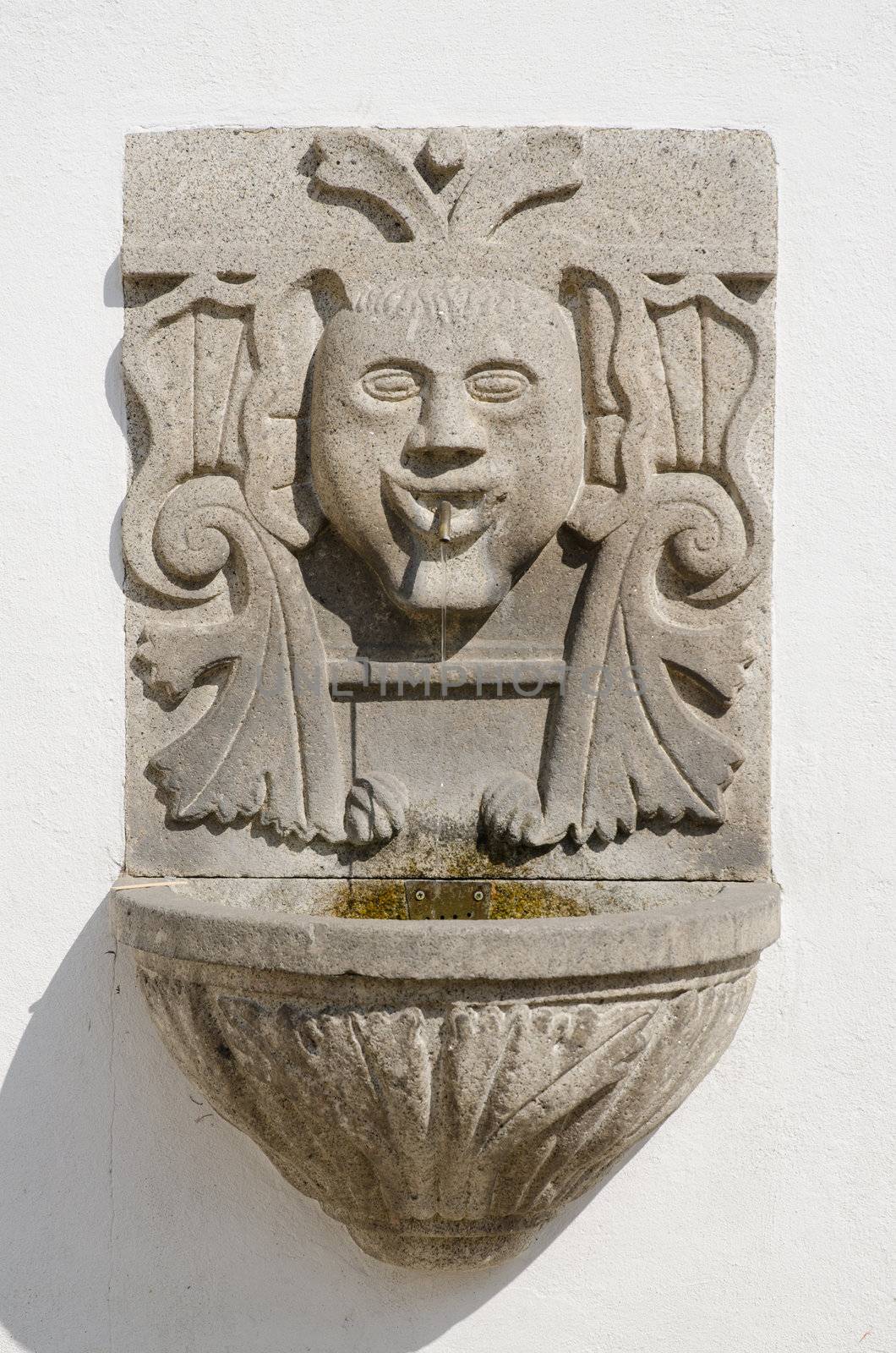 Fountain in a white wall, Penafiel, Portugal.