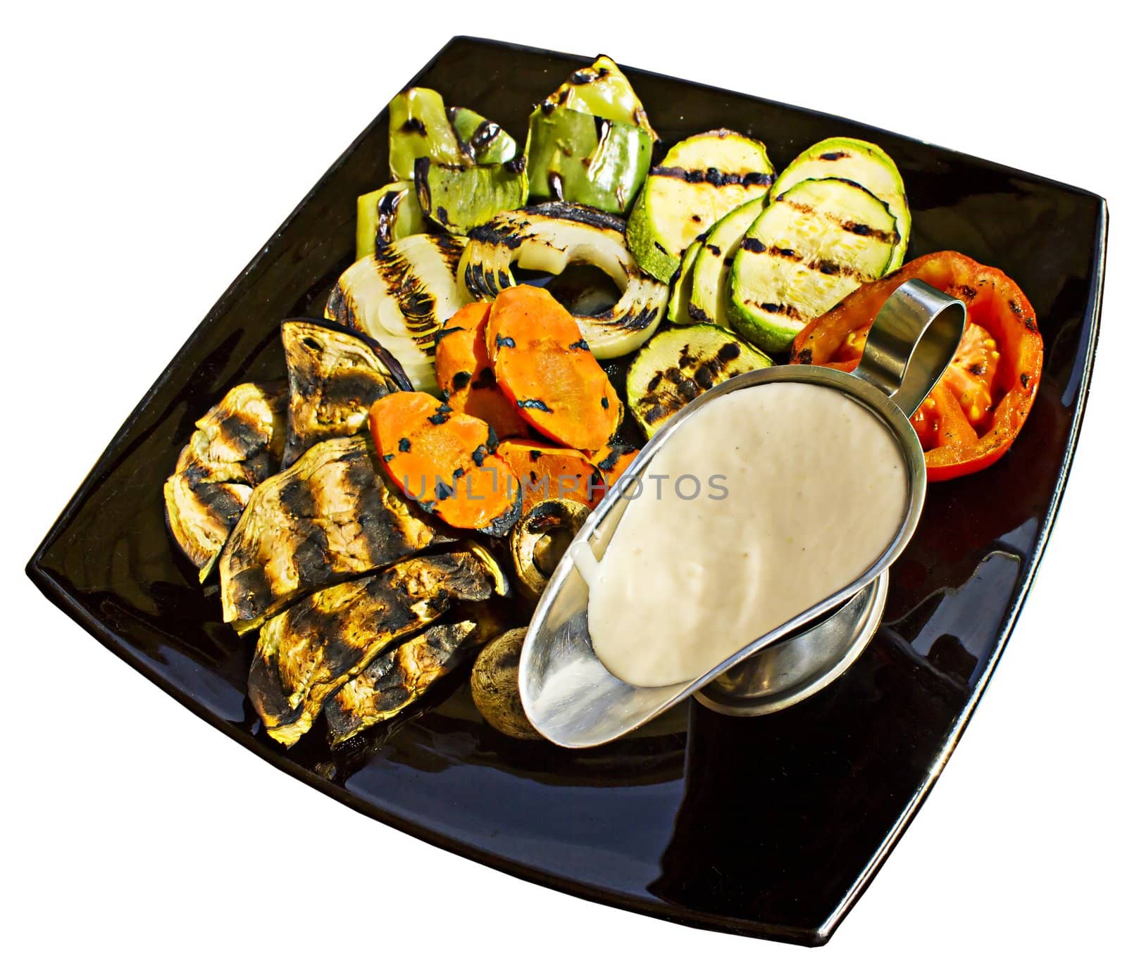 Grilled vegetables with milk sauce, isolated on white background.