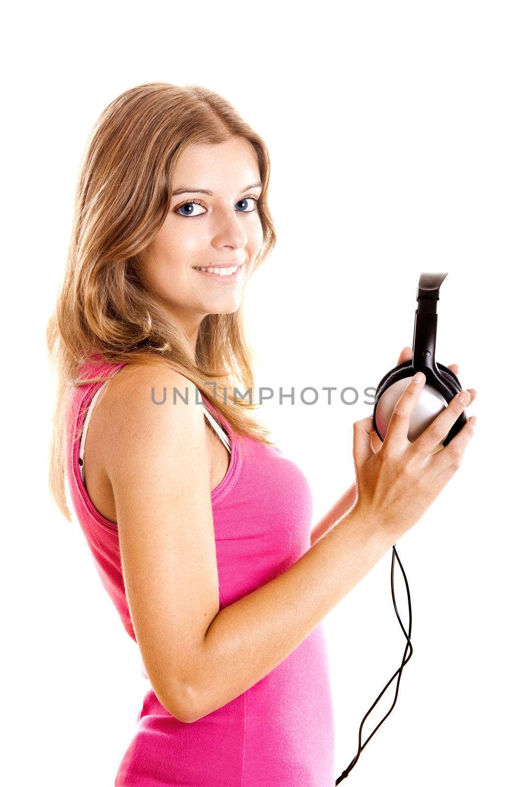 Beautiful young woman holding headphones isolated on white