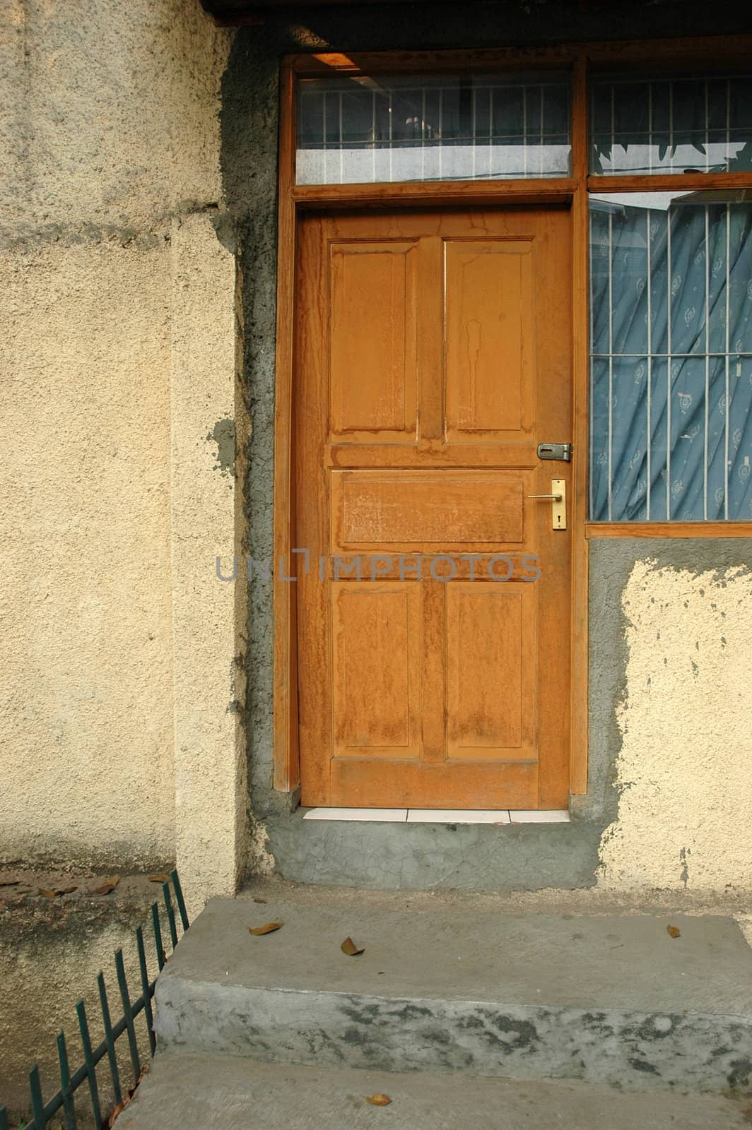 a wooden door in stone and brick wall