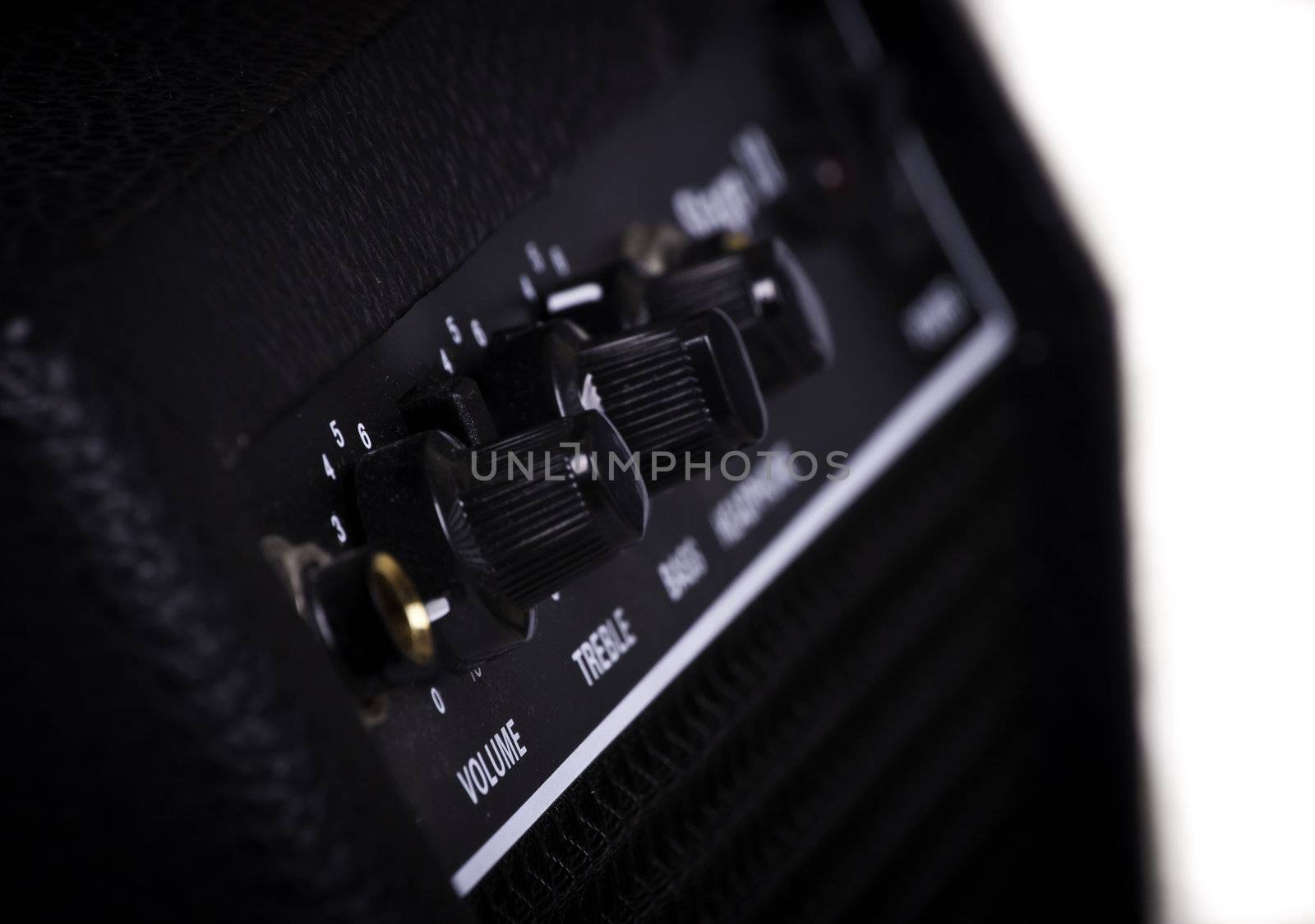 Knobs of different functions on a guitar amp