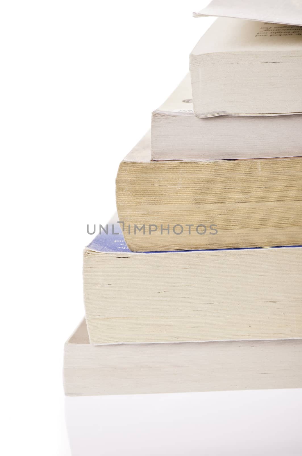 Stack of five, old discoloured books, isolated on white backgroud
