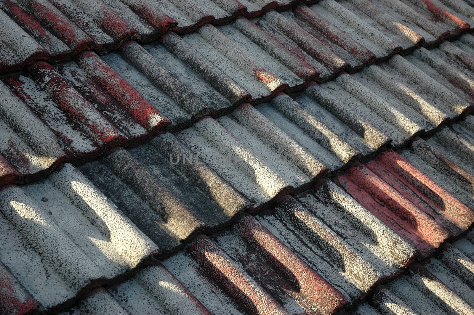 Pattern of roof tiles on an old roof