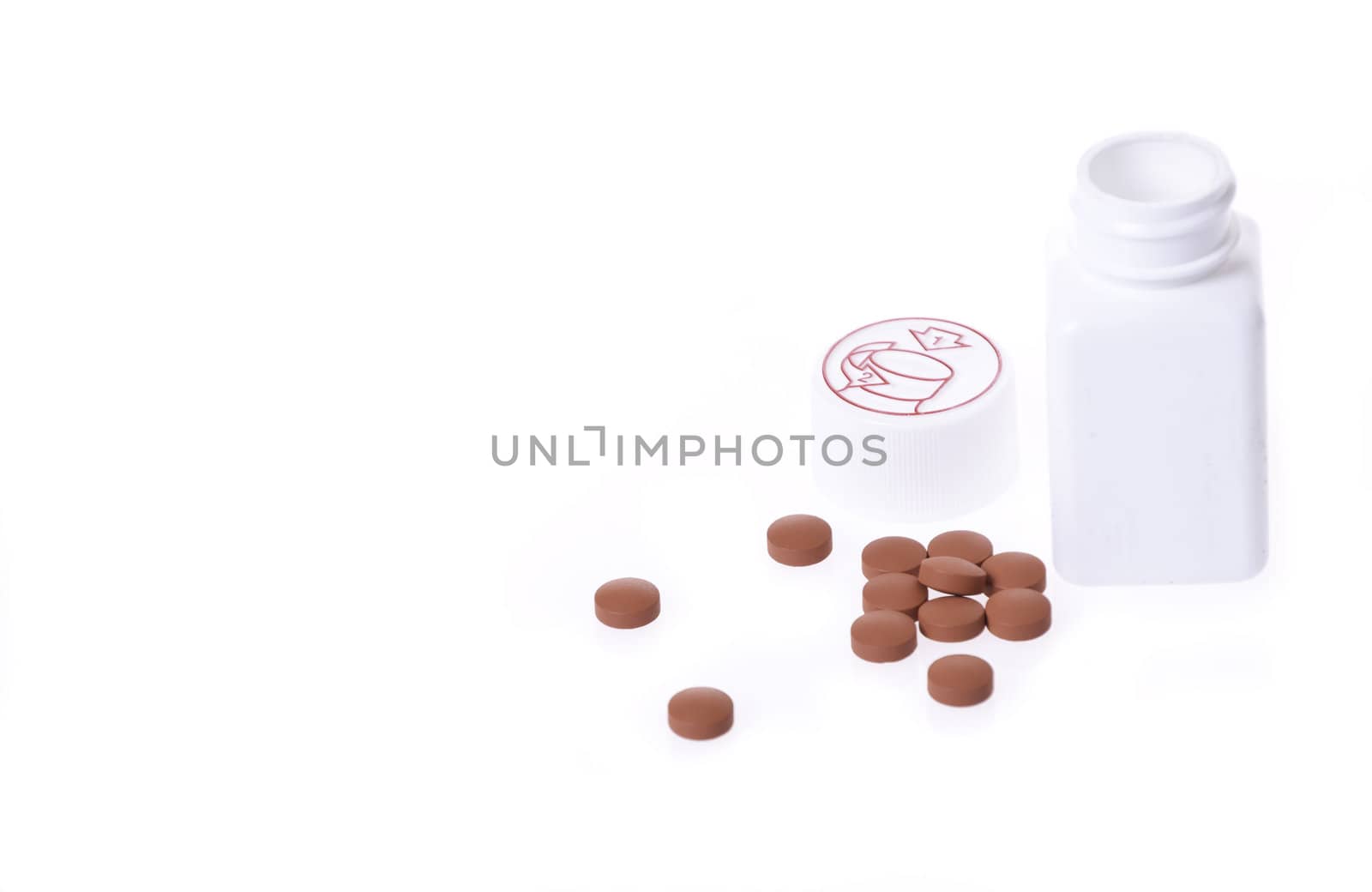 A white pill bottle with red generic pills  on a white background.