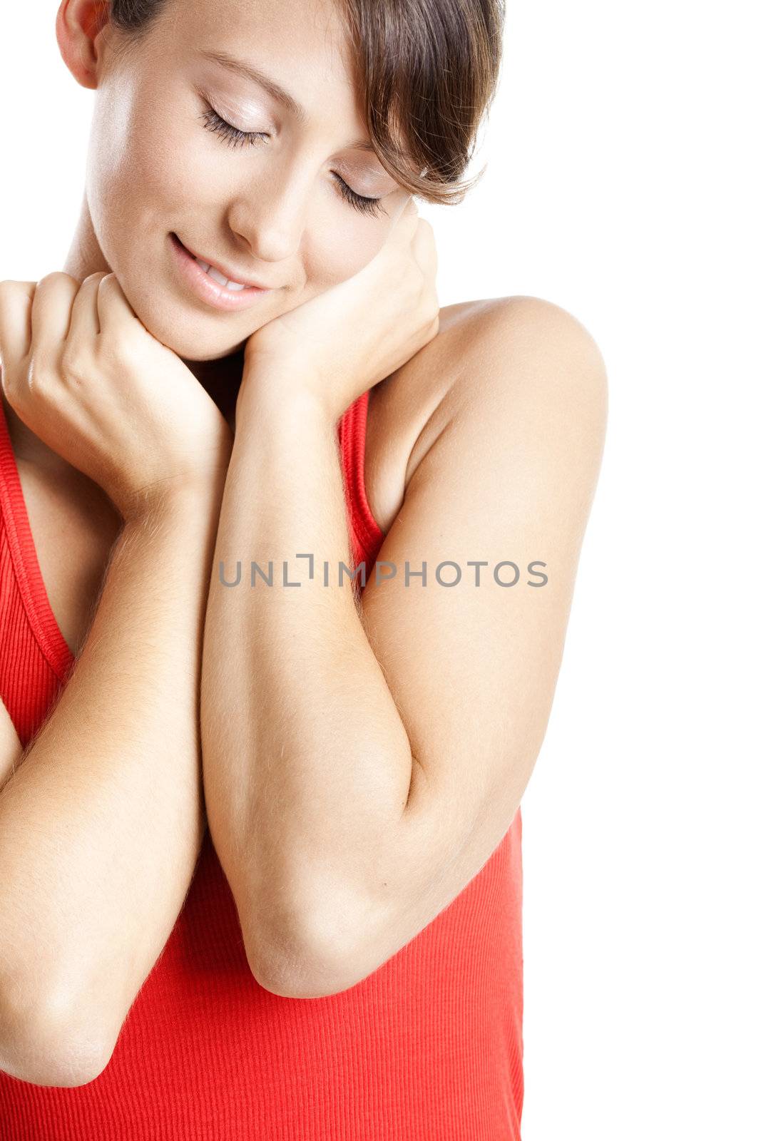 Portrait of a beautiful young woman whit both hands on the face
