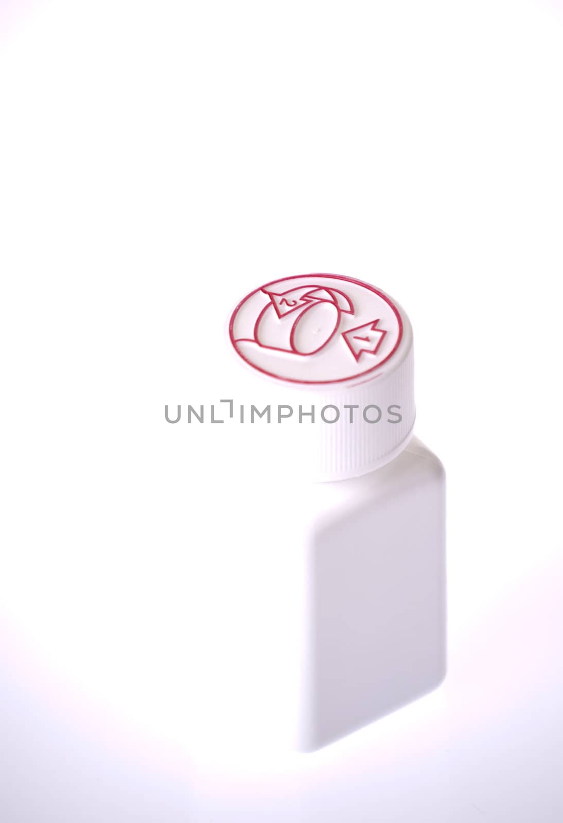 White medicine bottle closed isolated on white