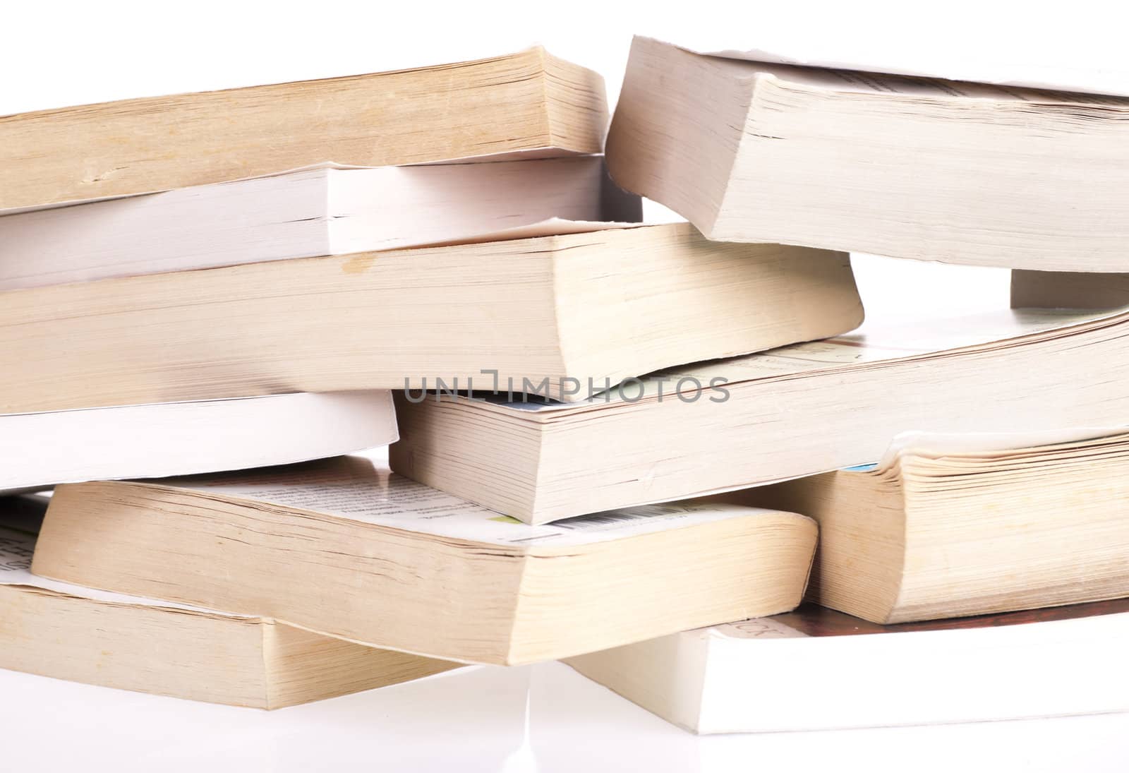 Stack of old books isolated on white