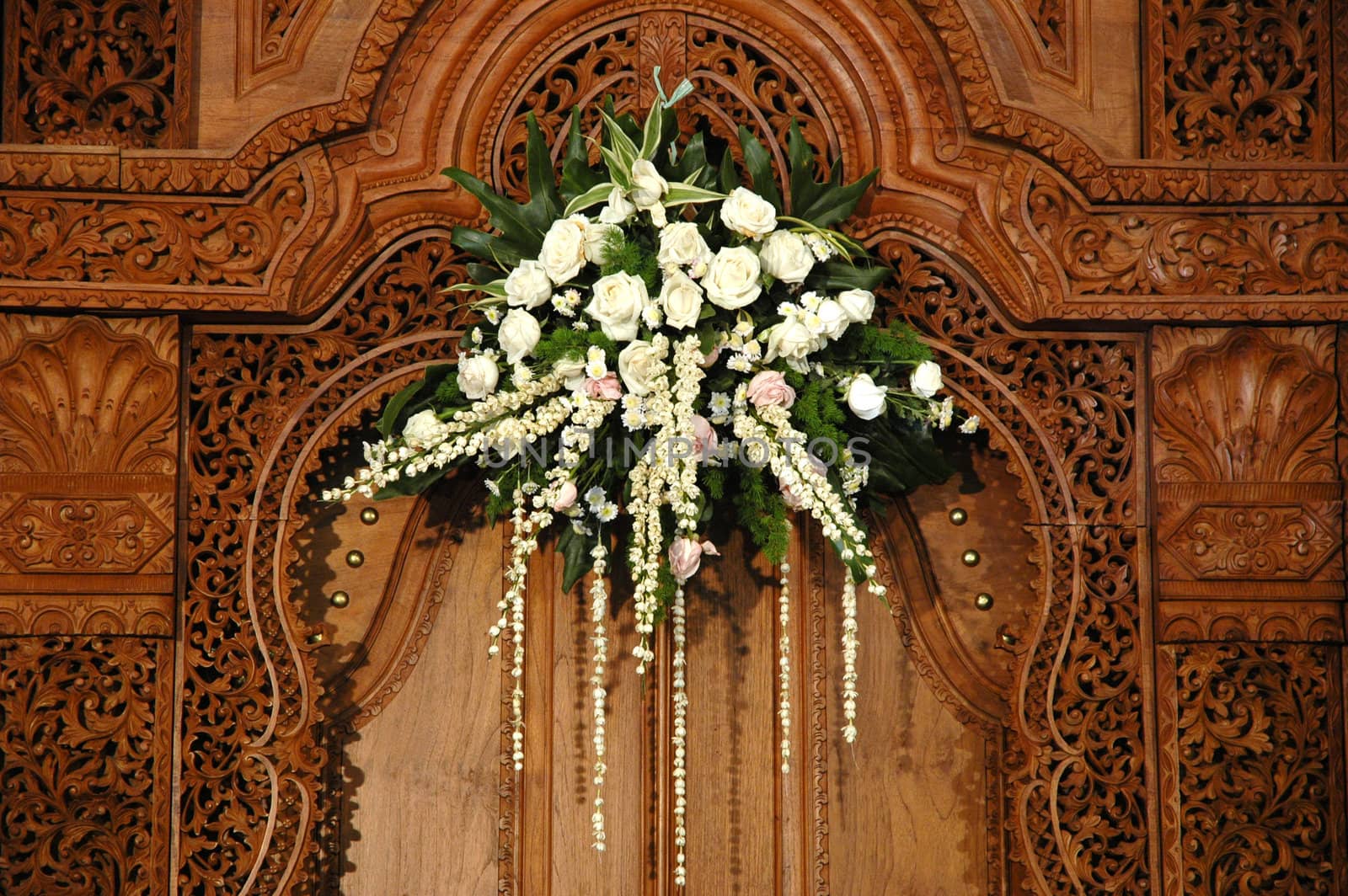 wedding bouquet with beautifull jasmine flower hanging on the wall