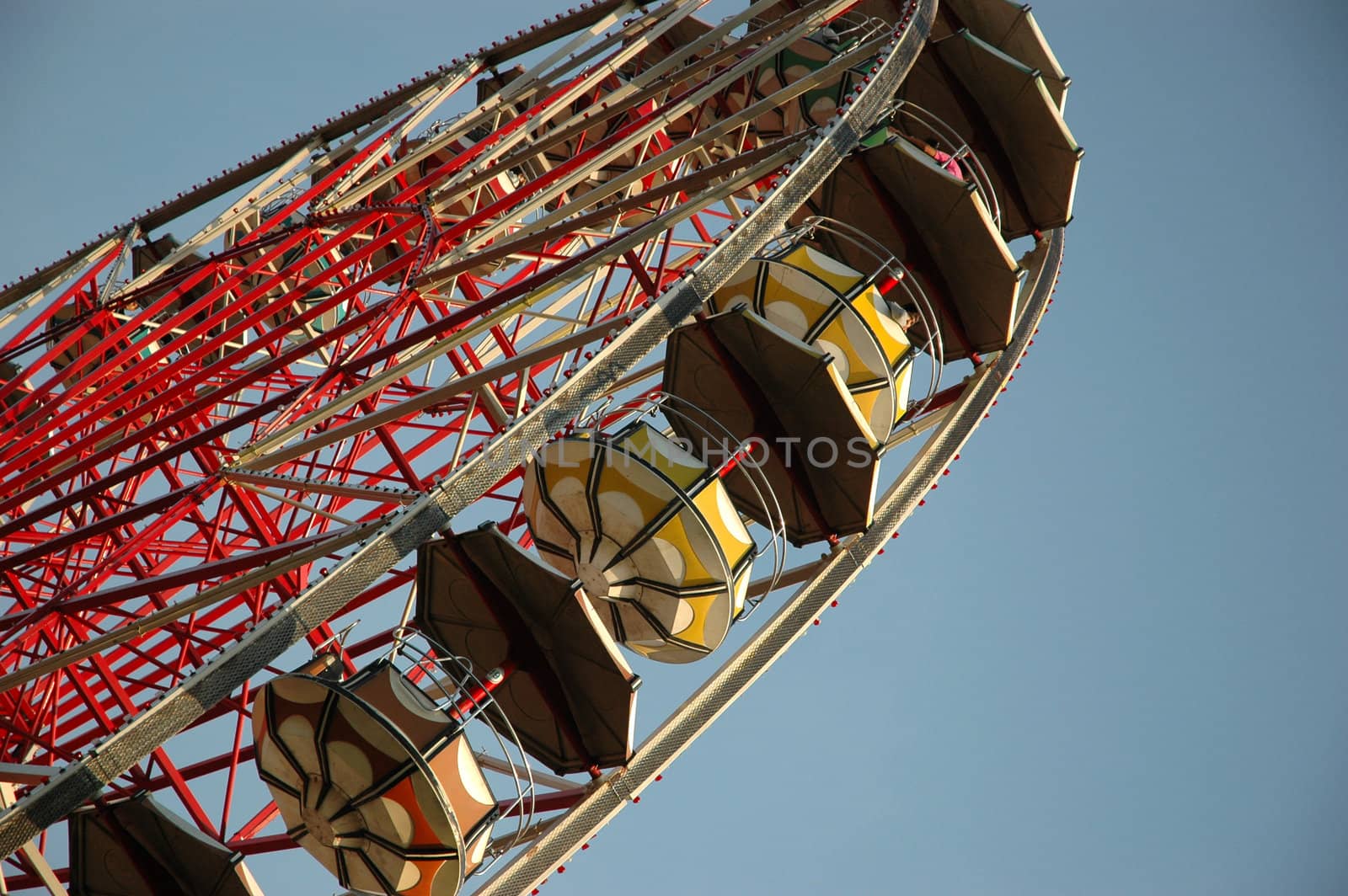 giant farris wheel against blue sky background