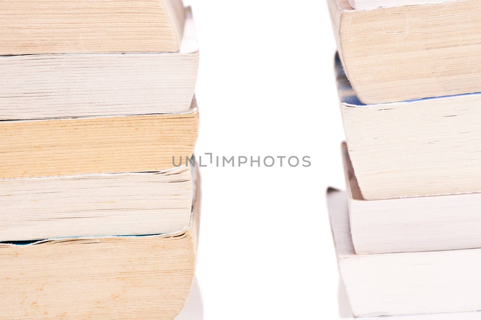 Two stacks of books on white background