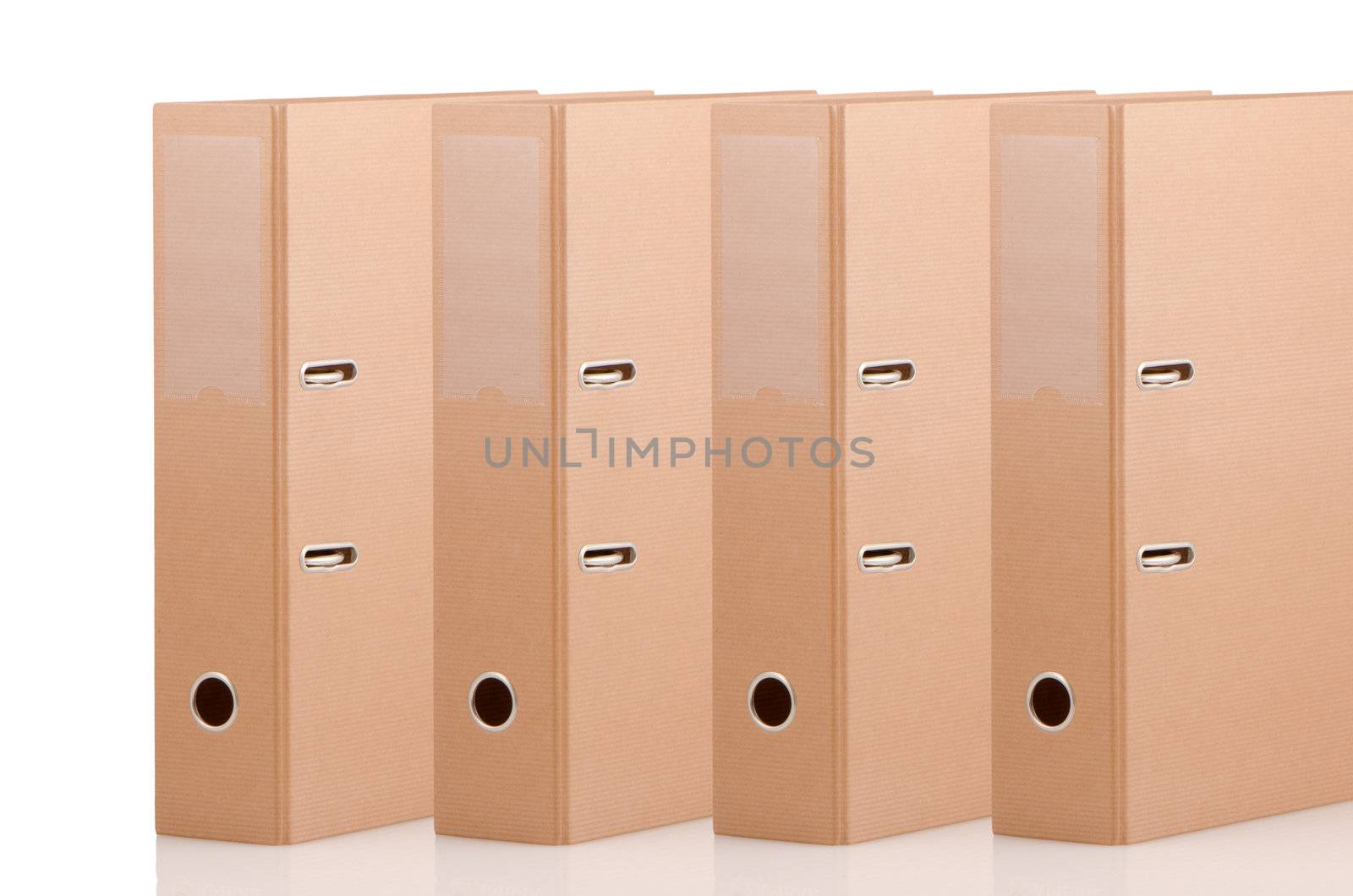 Four brown binders on white background.