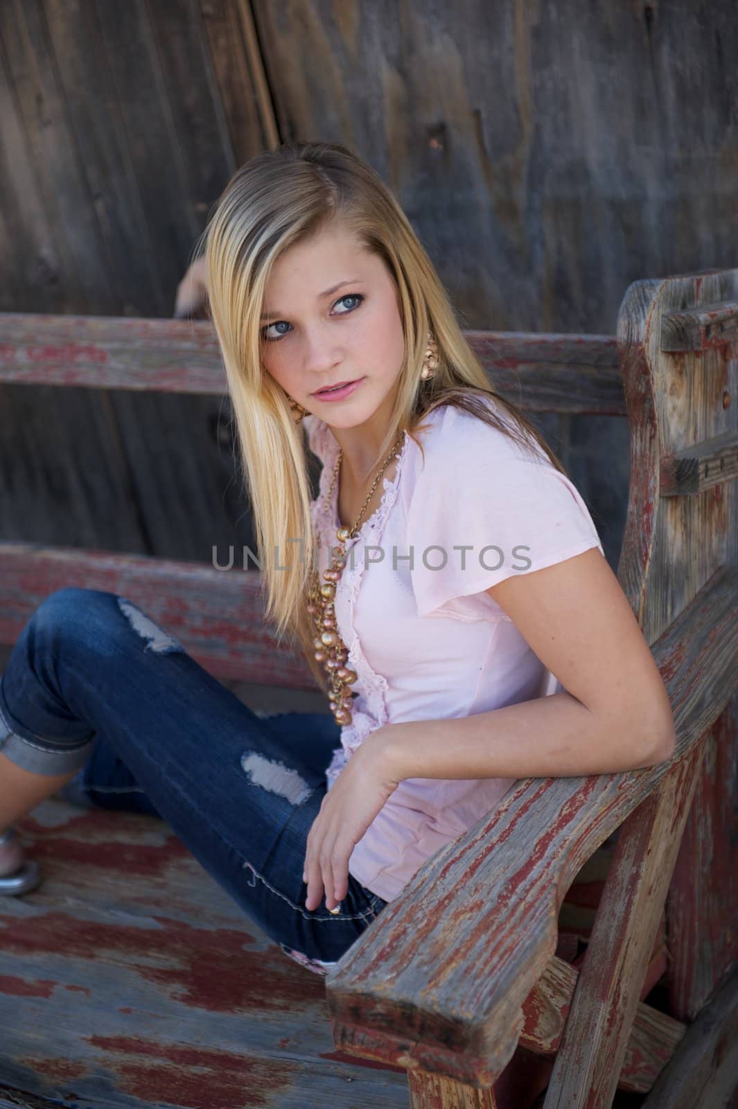 Beautiful Blonde Girl on Wooden Bench by pixelsnap