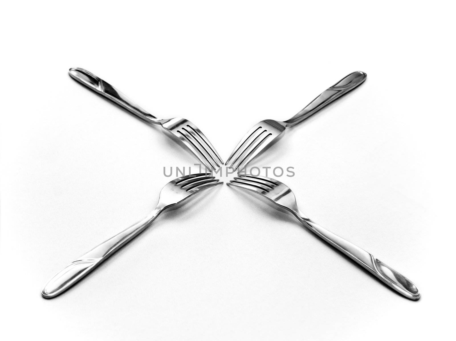 Four forks placed head to head