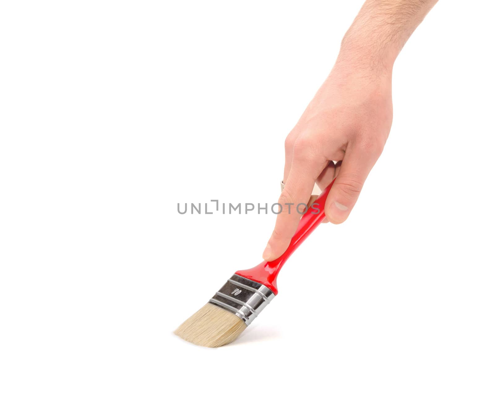 Human hand with a brush on a white background