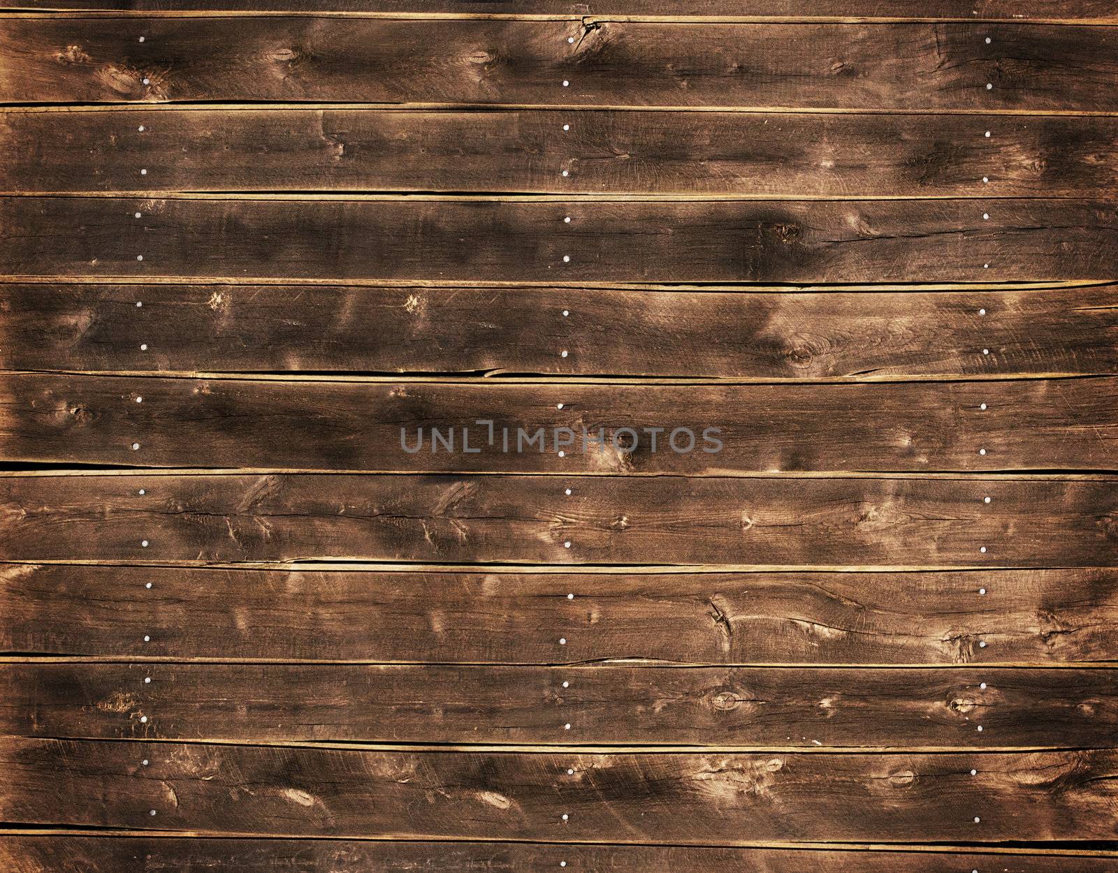 Close up of a wood fence with nails