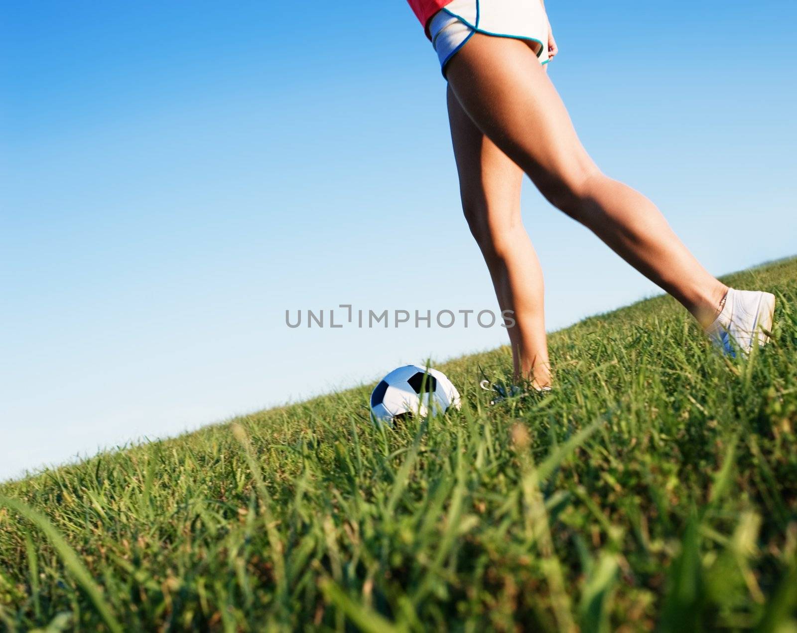 Young Woman Playing Soccer by cardmaverick
