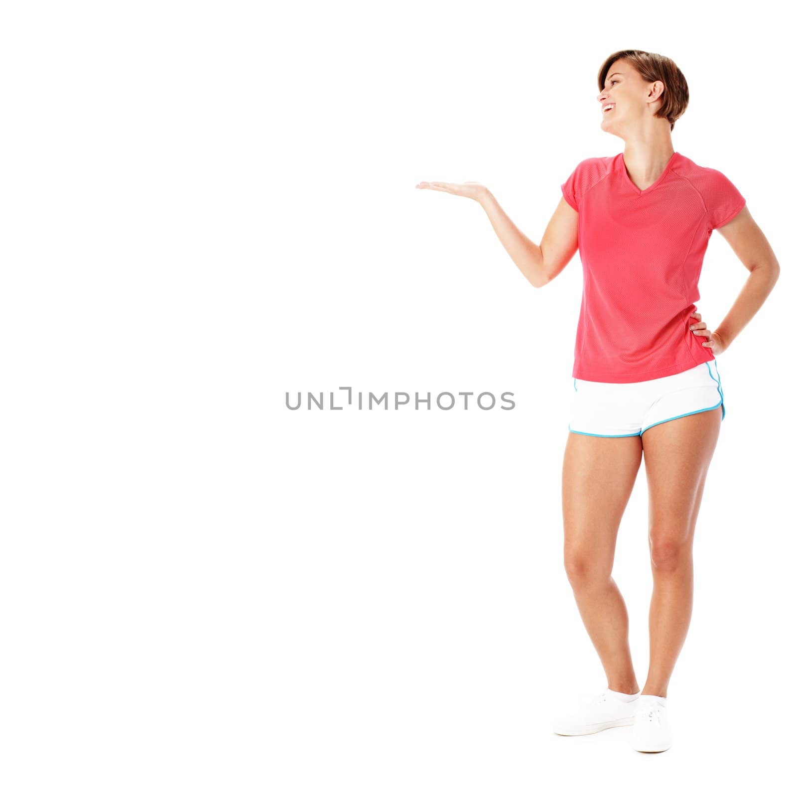 Young fit woman isolated on white presenting to empty copyspace, from a complete series of photos.