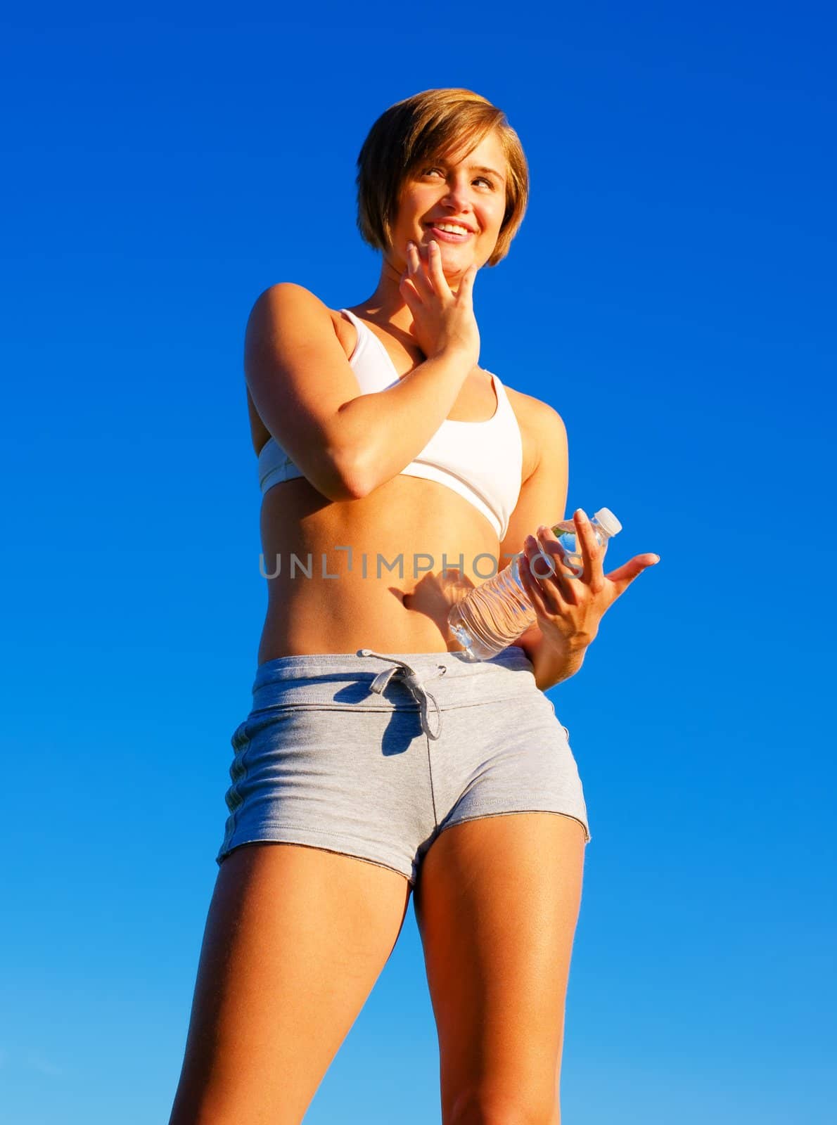 Fit young woman working out, from a complete series of photos.