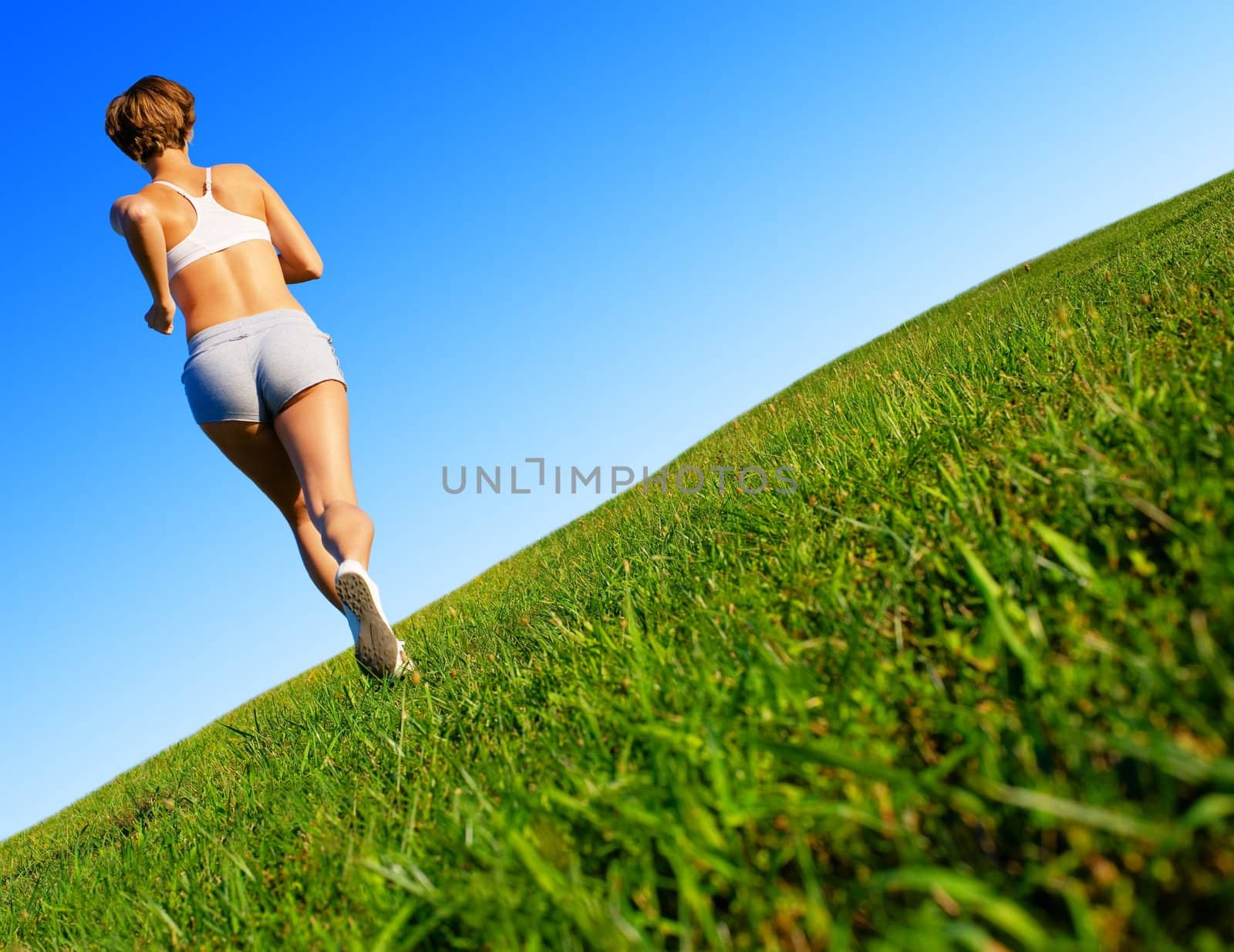 Fit young woman working out, from a complete series of photos.