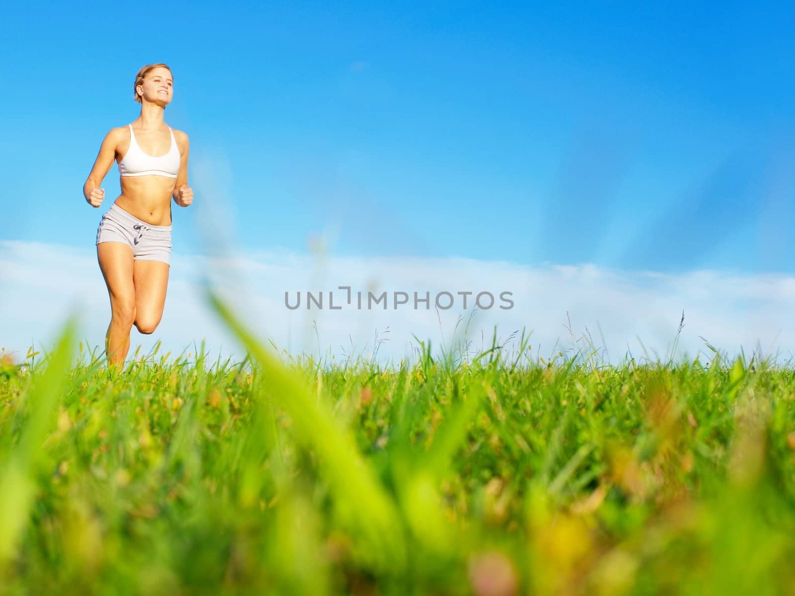 Fit young woman working out, from a complete series of photos.