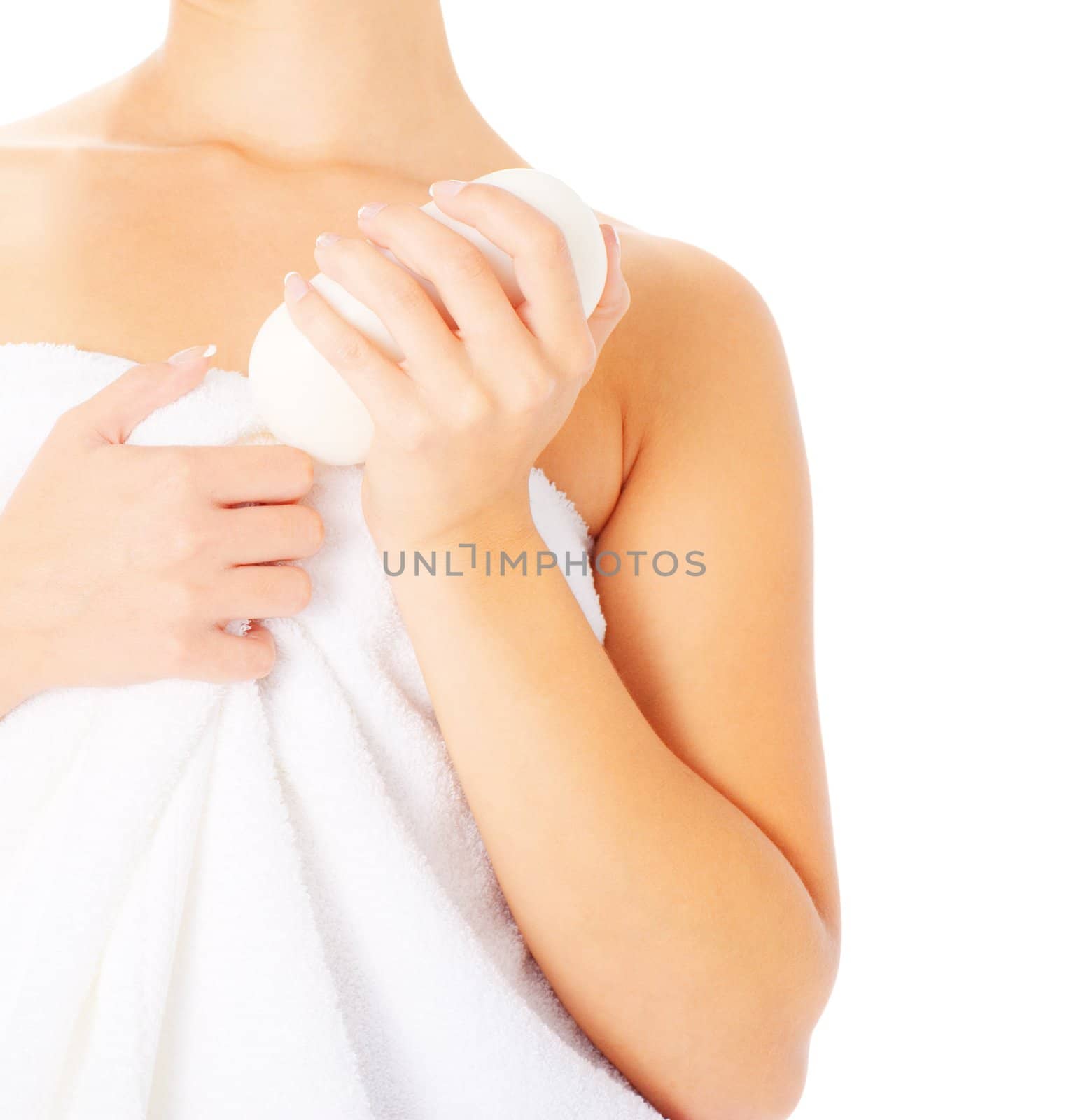 Close up of woman wrapped in a towel holding soap, from a complete series of images.