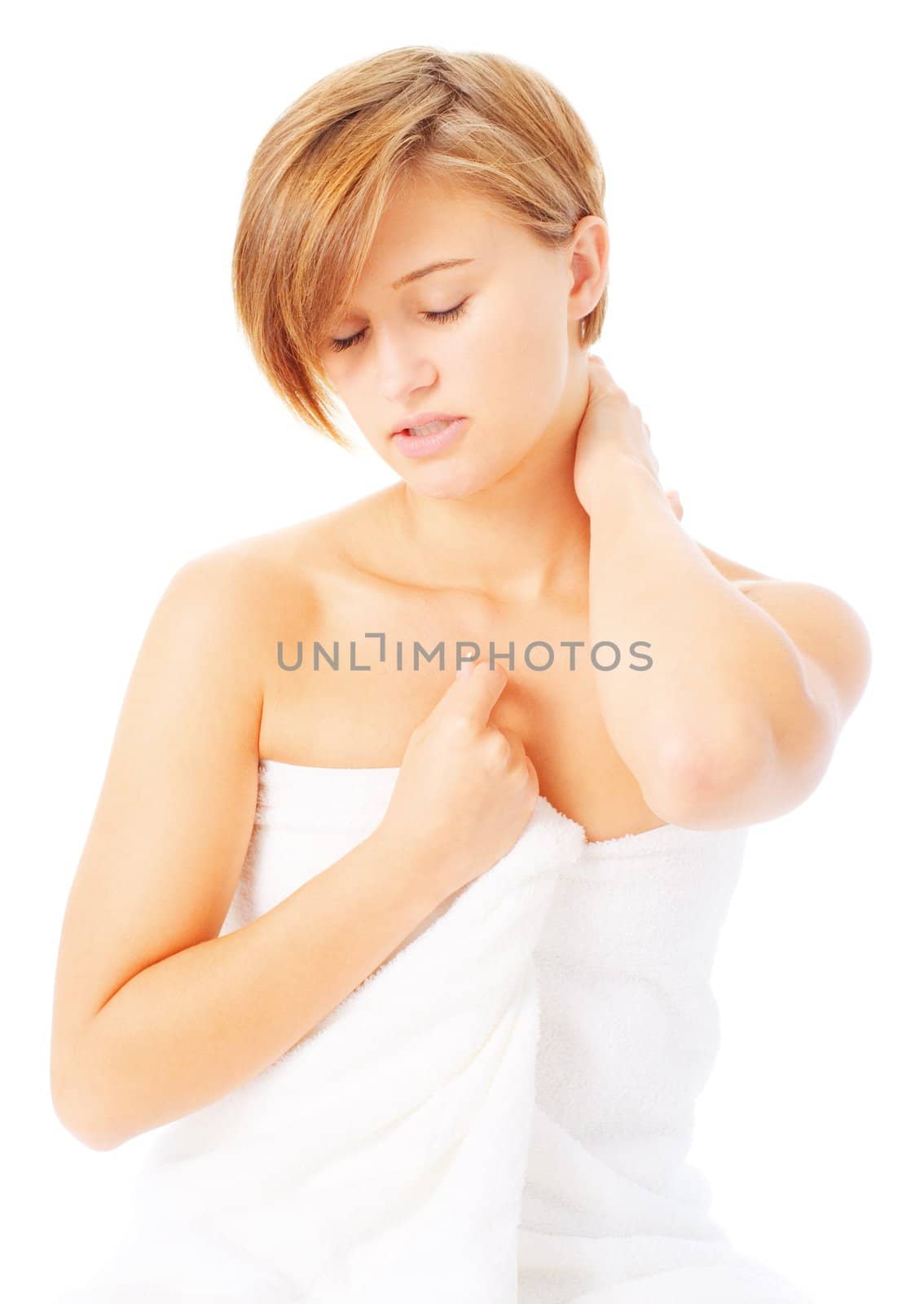 Woman in a towel massaging herself, from a complete series of photos.