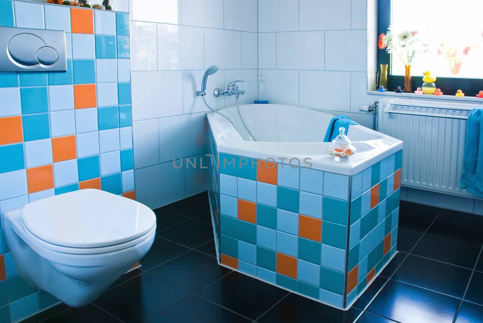 Colorful white and blue bathroom with black floor by Colette