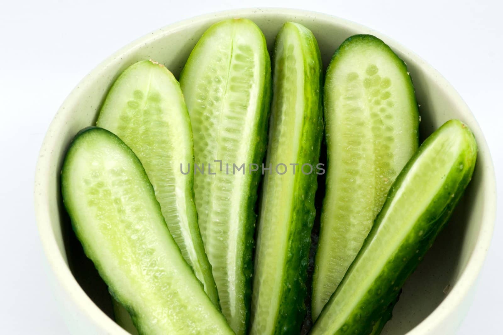 Sliced cucumber in the dish by helgy