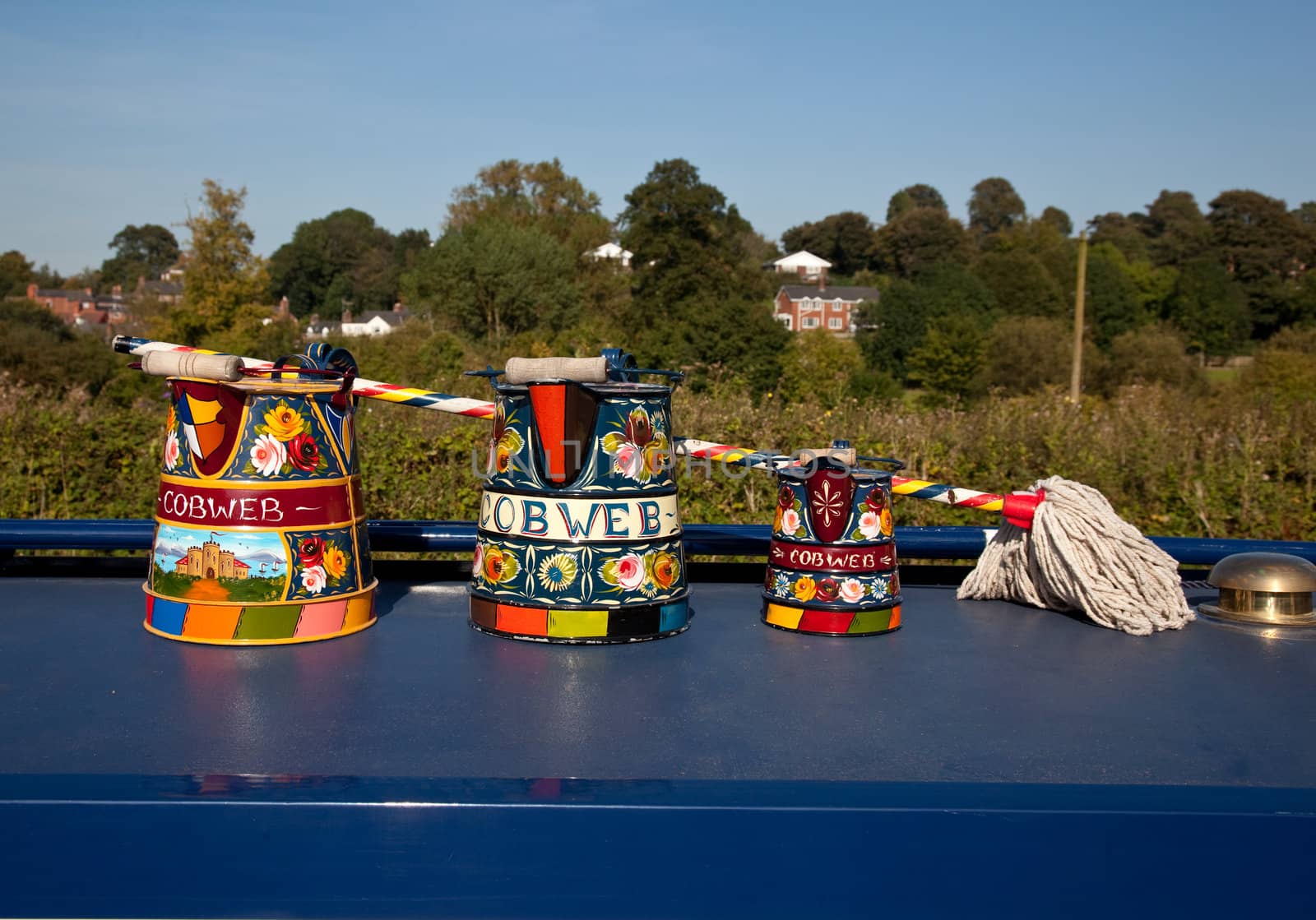 Canal life in England with traditionally decorated tools on display