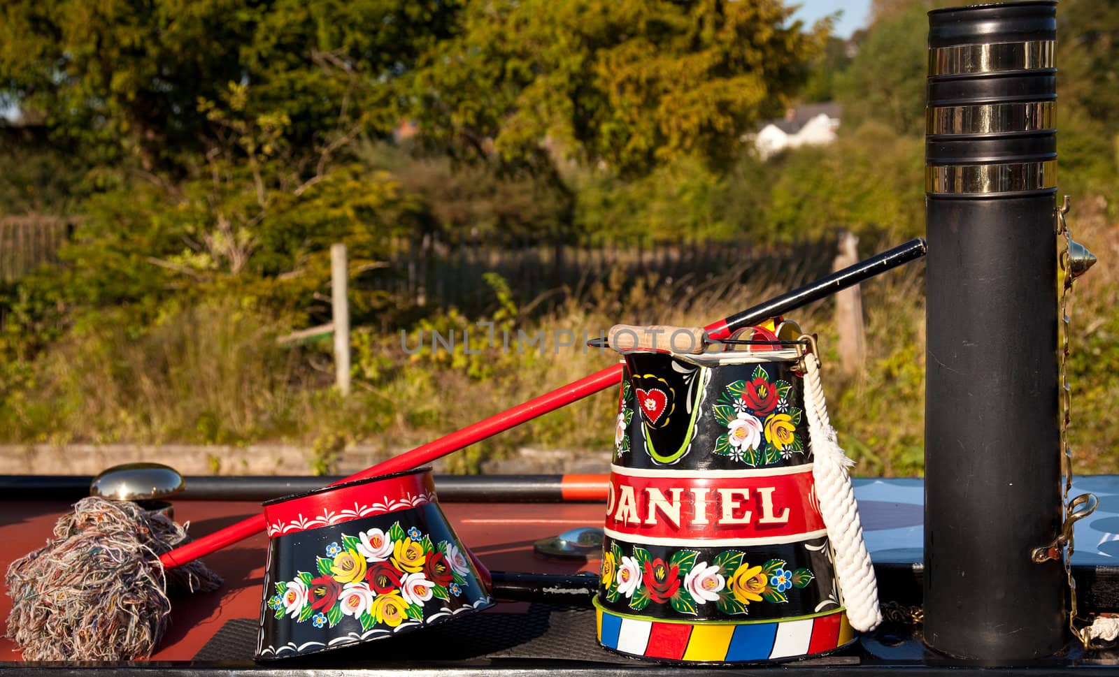 Canal life in England with traditionally decorated tools on display